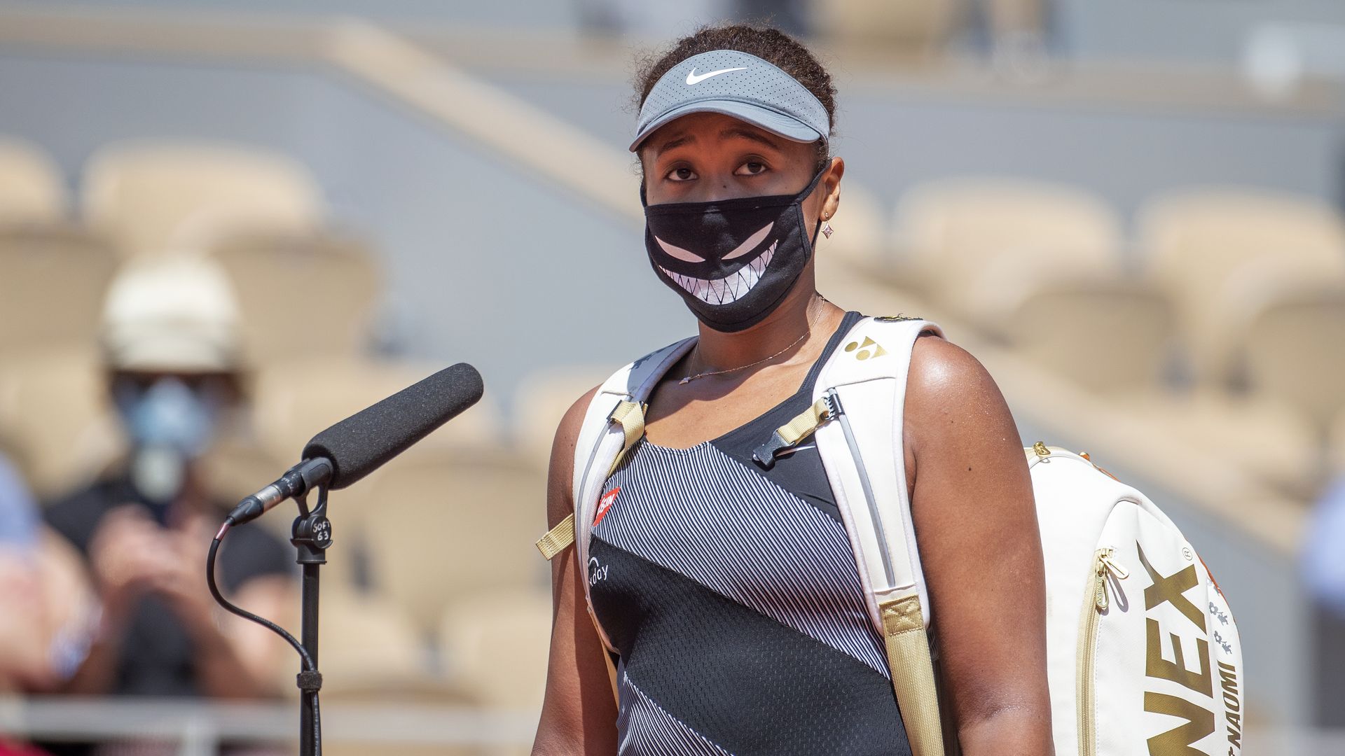 naomi osaka speaking with a mask on