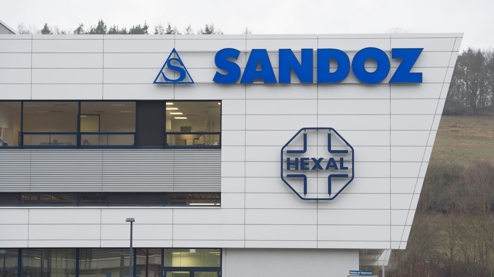 A white building with the blue Sandoz logo.