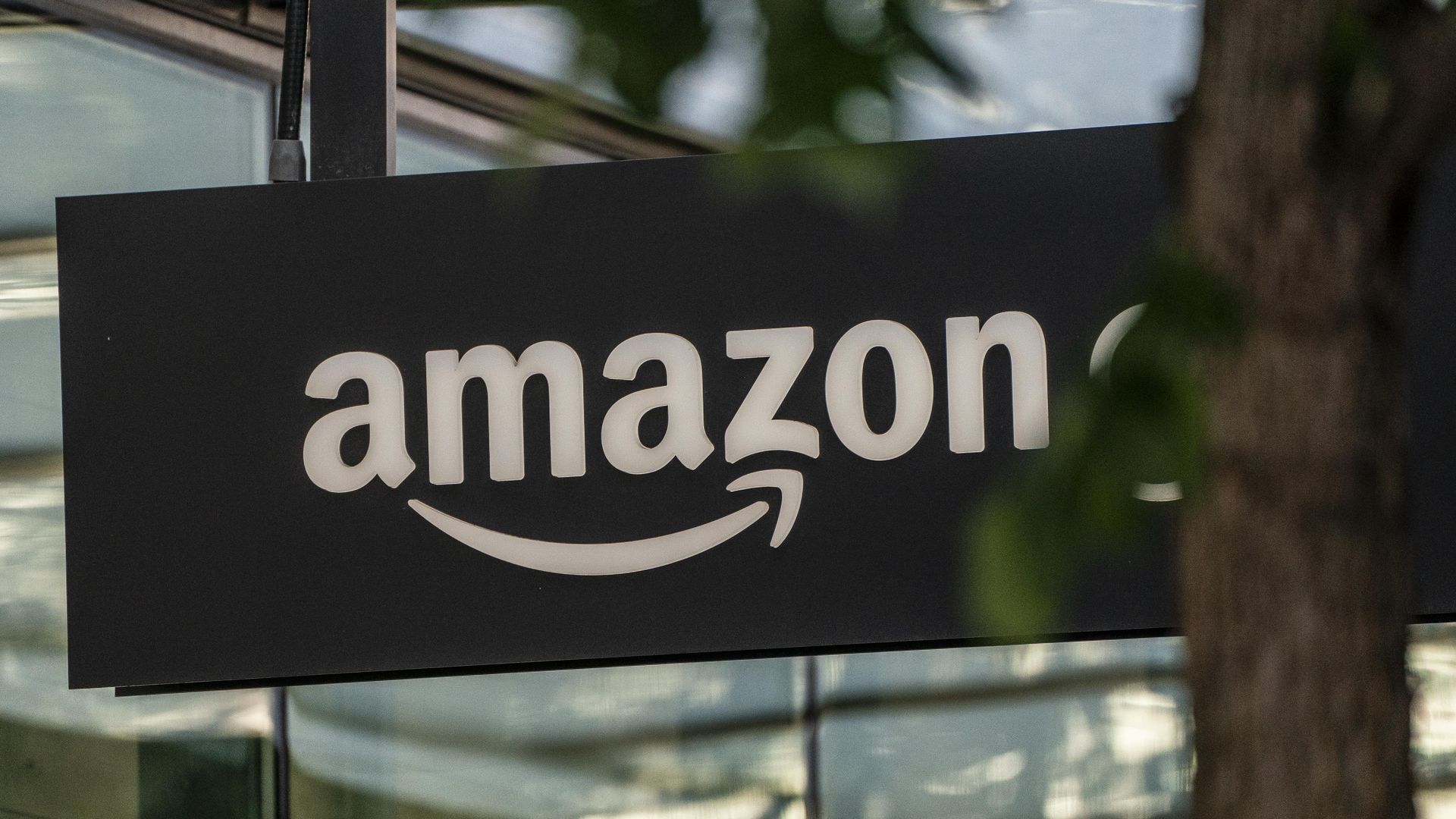 A sign is seen outside of an Amazon Go store at the Amazon.com Inc. headquarters on May 20, 2021 in Seattle, Washington