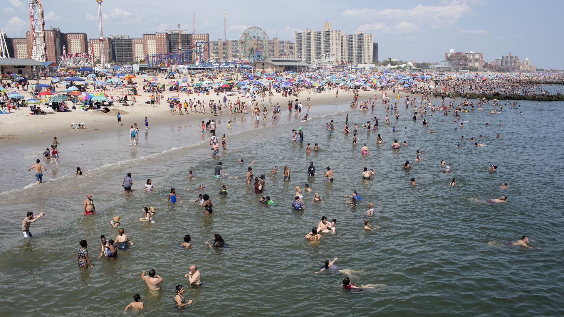  As a heat wave descends upon New York, people seek refuge from the record high temperatures at the beach in Coney Island on July 20, 2019 in New York City. 