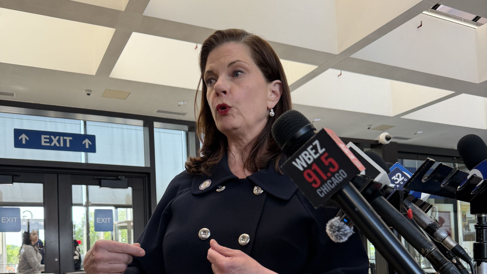 woman in front of microphones