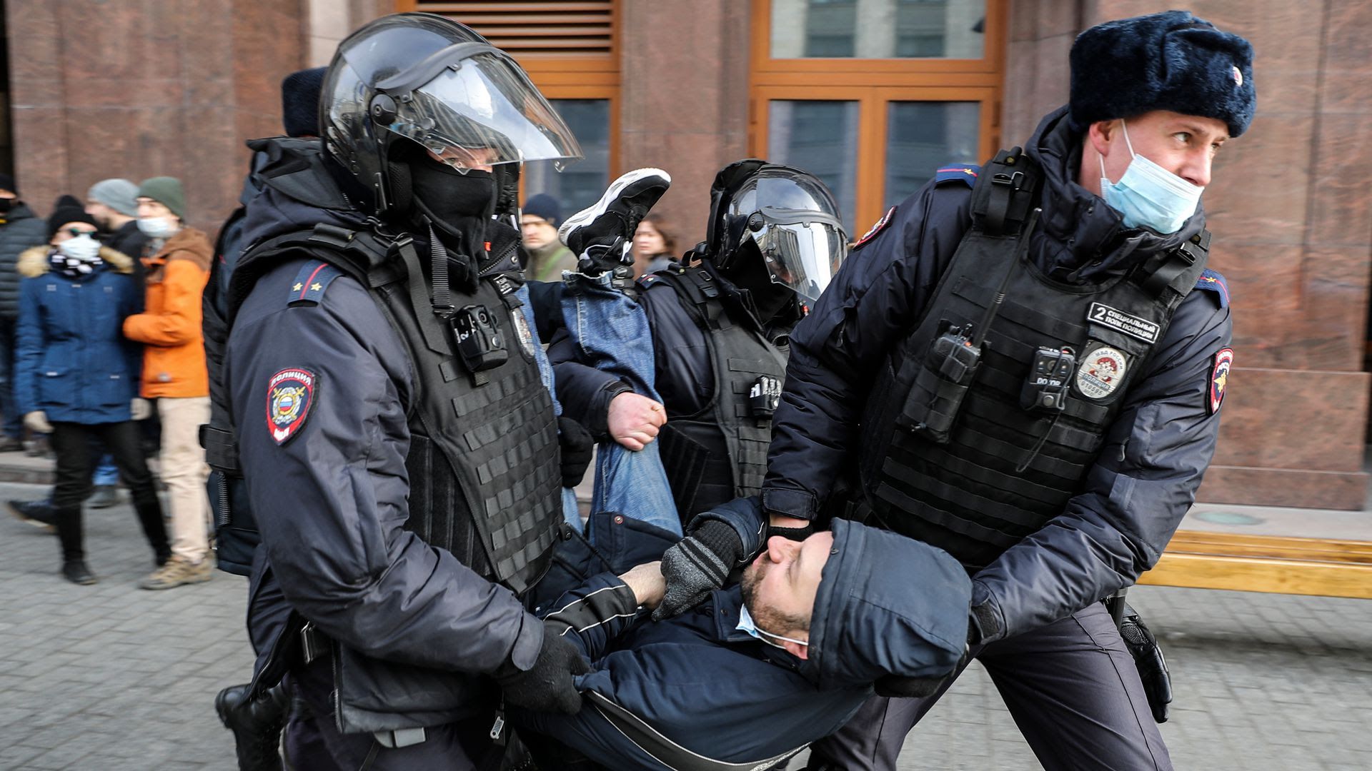 Police take away a protester