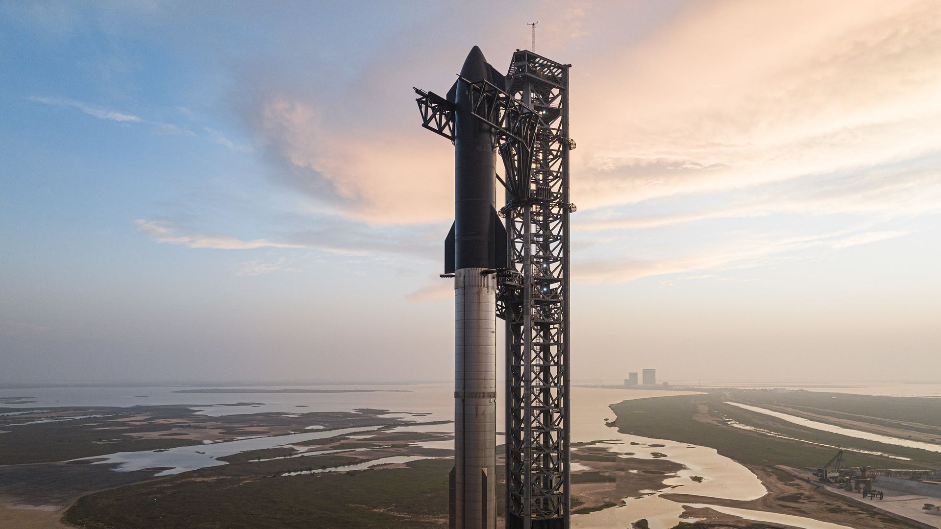 A Starship sits atop a rocket ahead of its test in April 2023