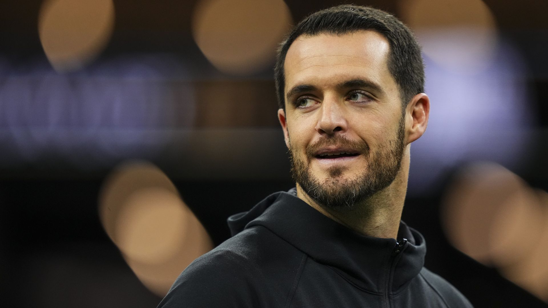 Derek Carr looks over his shoulder.