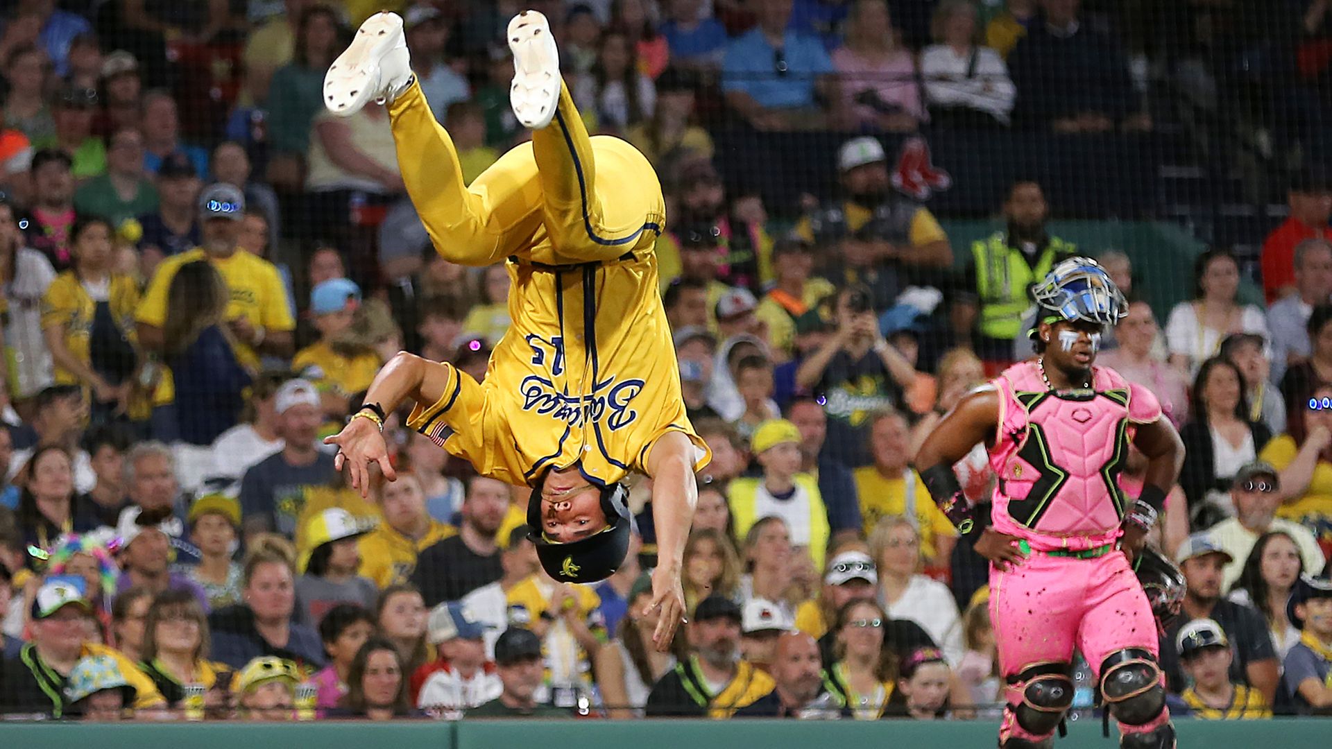 Savannah Bananas player RobertAnthony Cruz does a flip at home plate