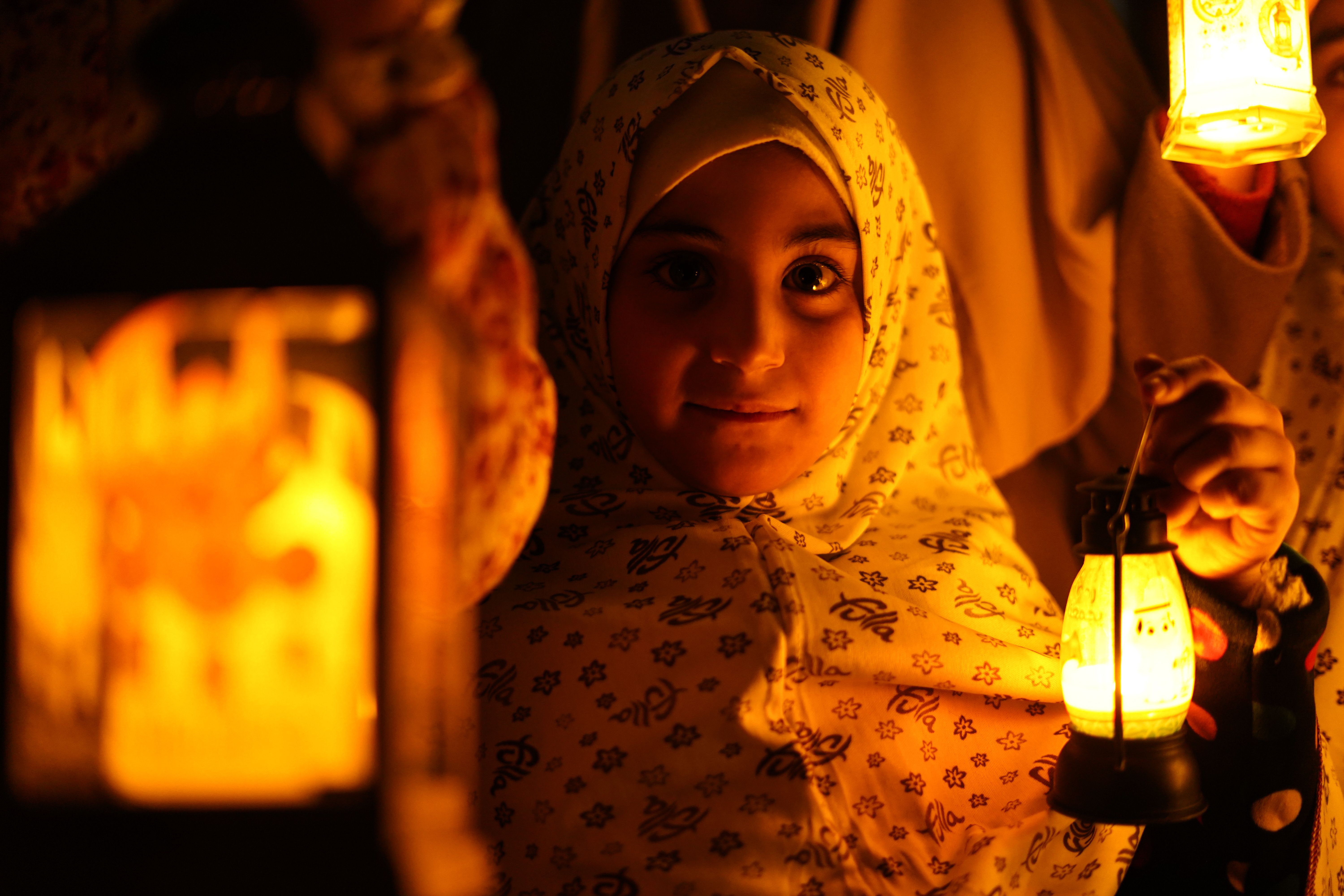 A child carries a lantern
