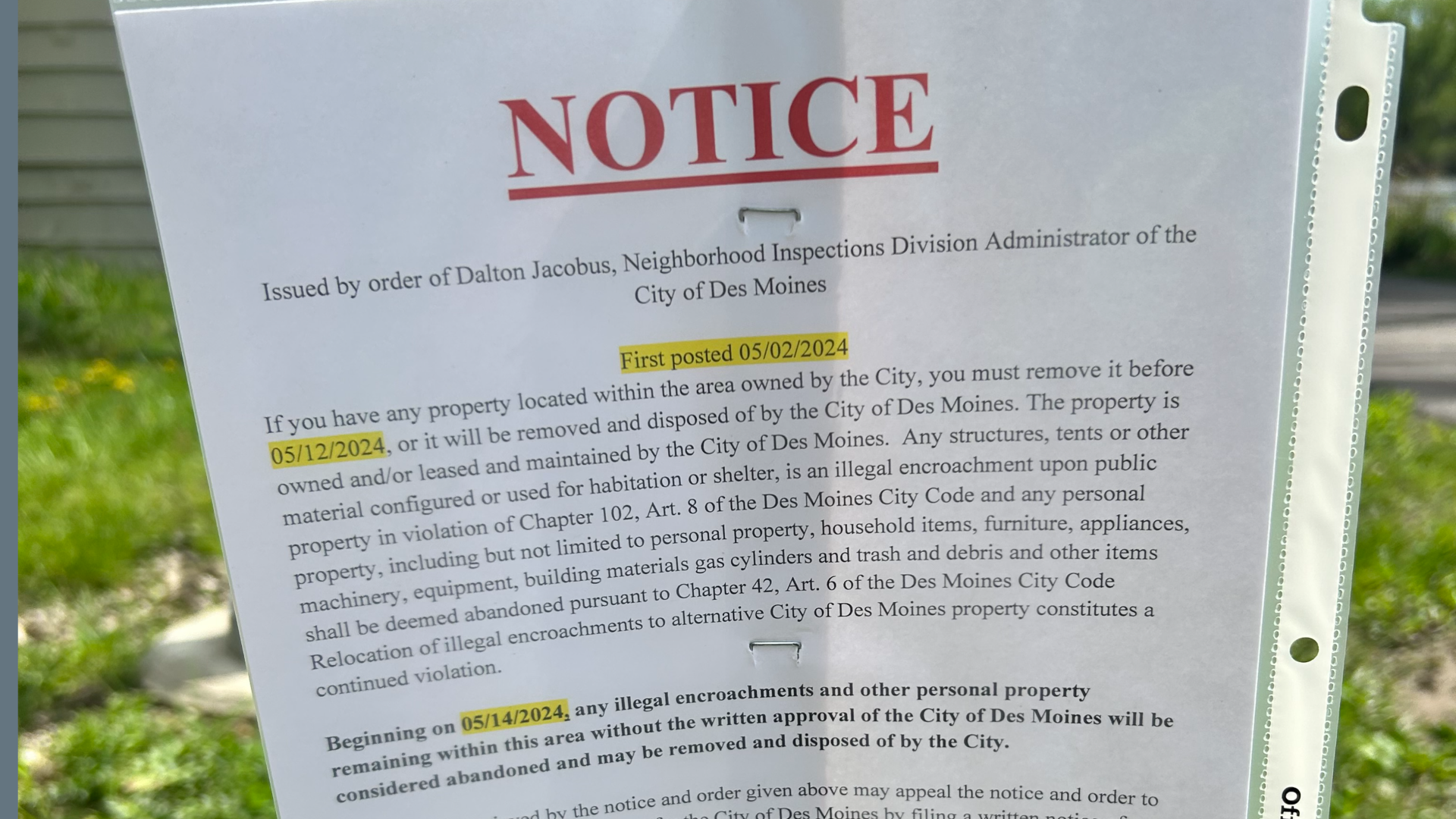 A photo of a Des Moines homeless camp notice.