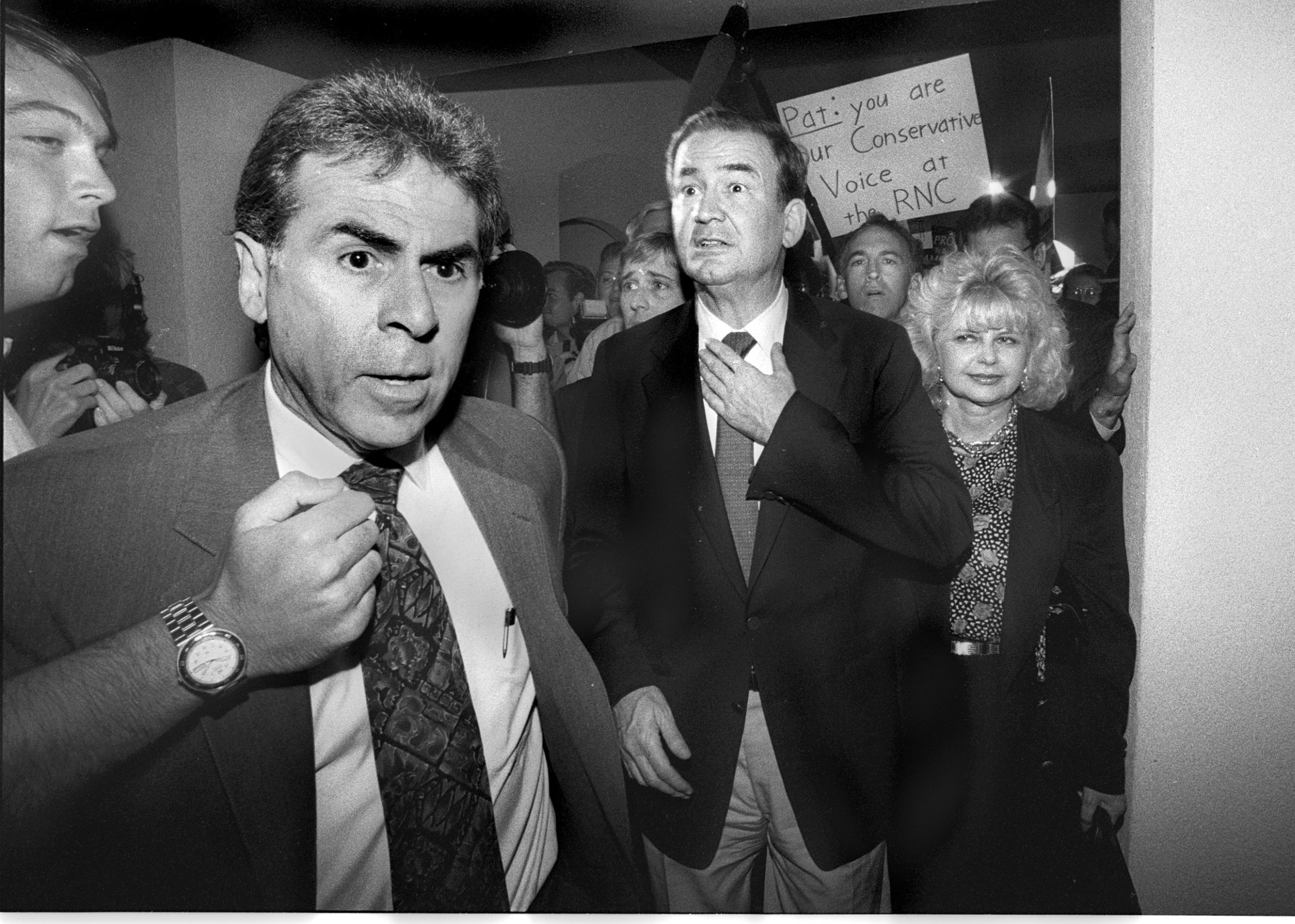 Pat Buchanan adjusts his tie before the 1992 GOP convention in Houston