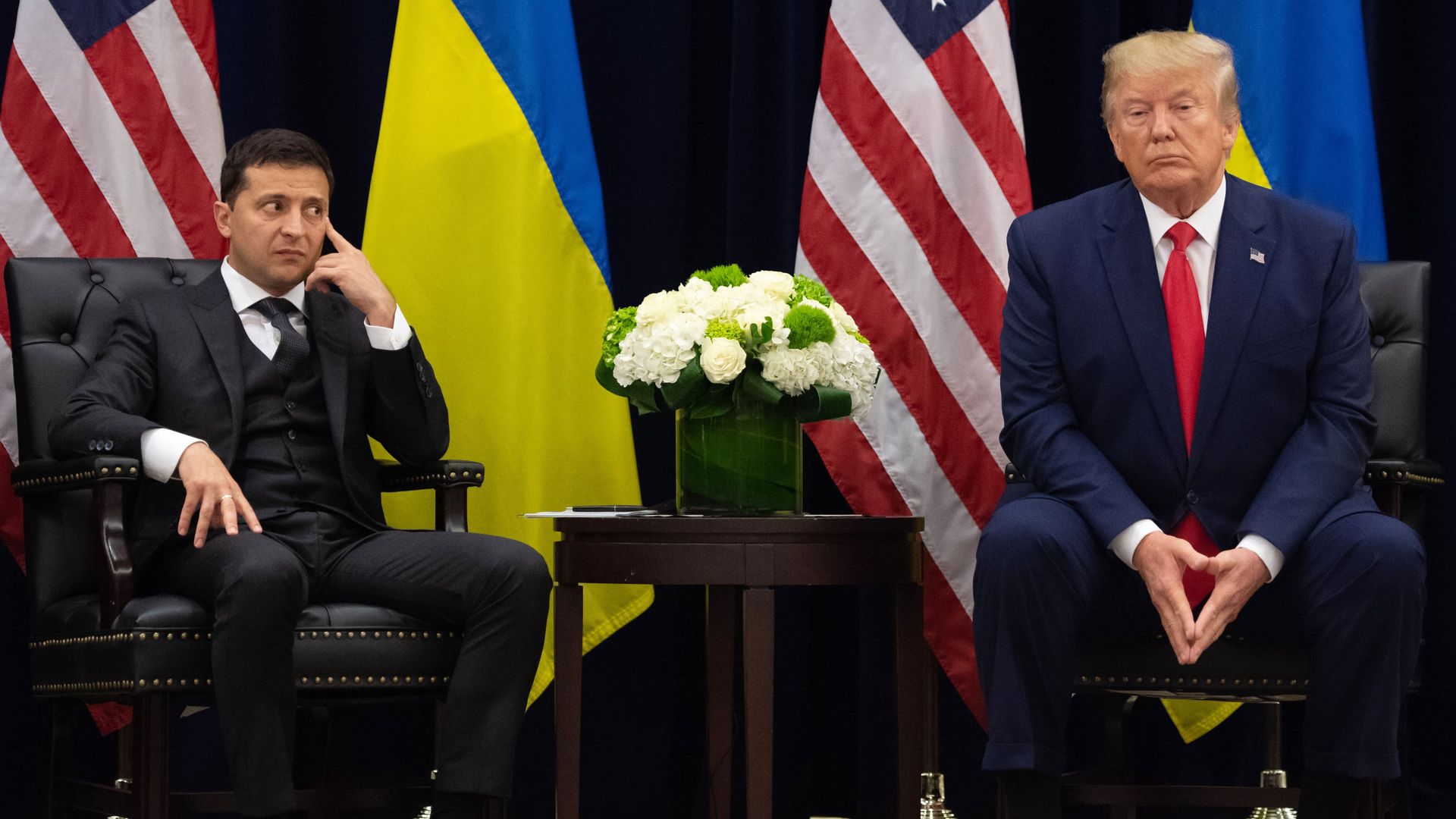 US President Donald Trump and Ukrainian President Volodymyr Zelensky looks on during a meeting