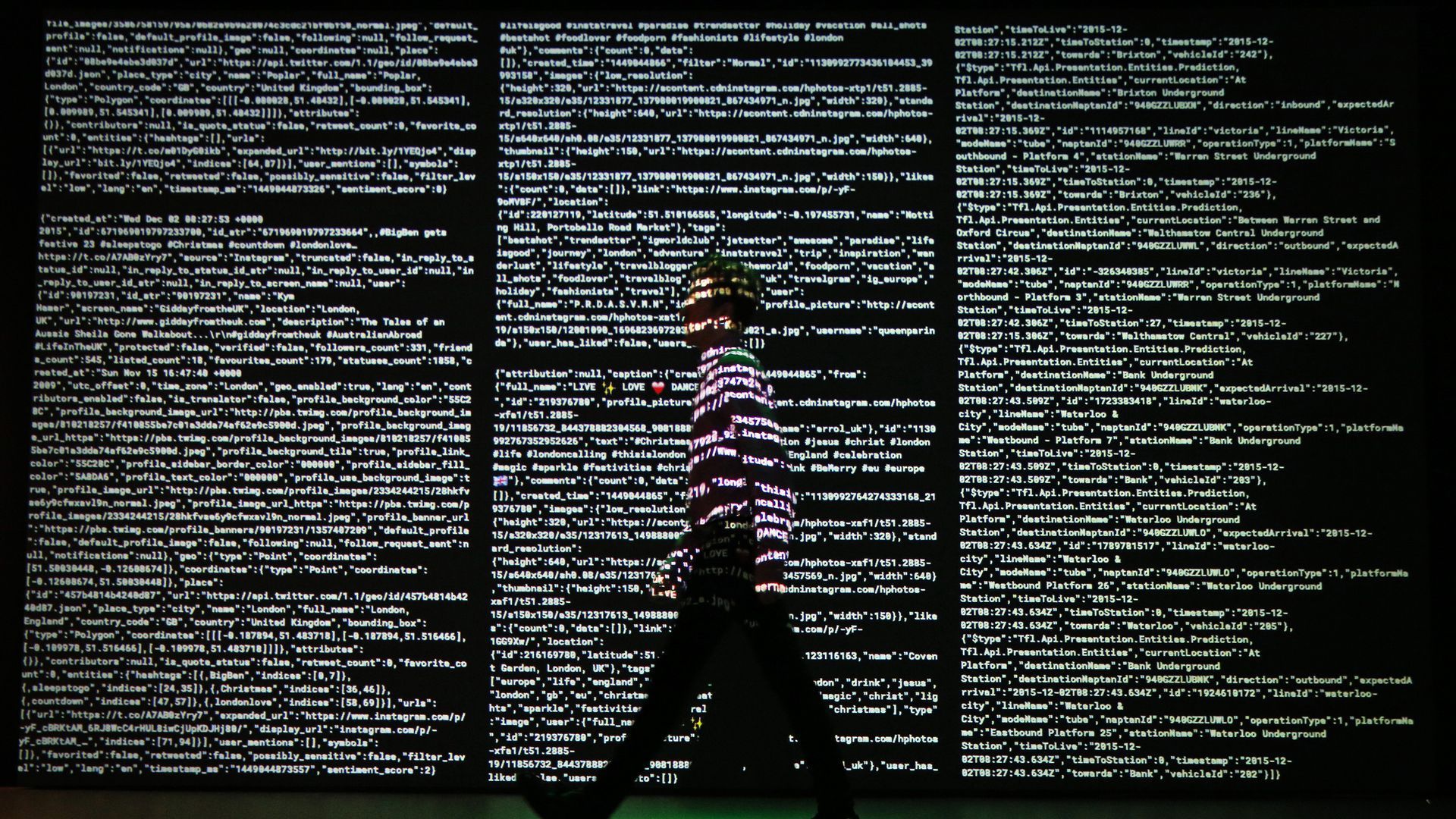 Man walking past data