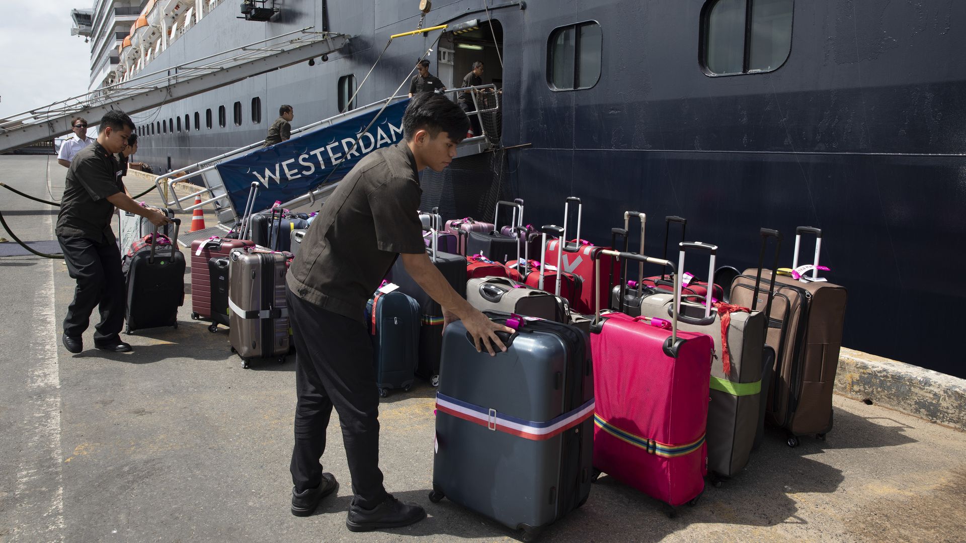 Luggage is ready as passengers get ready to disembark the MS Westerdam cruise ship docked in Sihanoukville, Cambodia on February 14