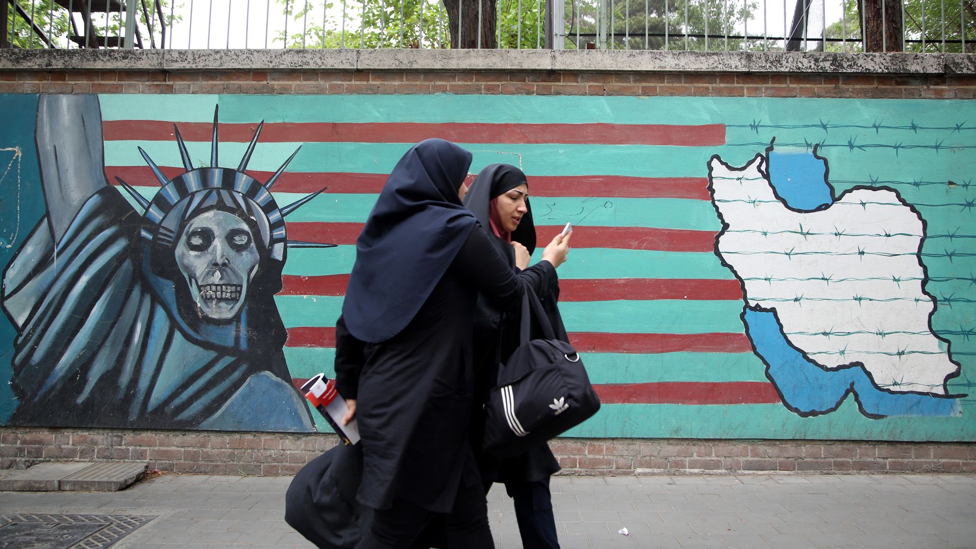 A mural that shows the Statue of Liberty as a skeleton