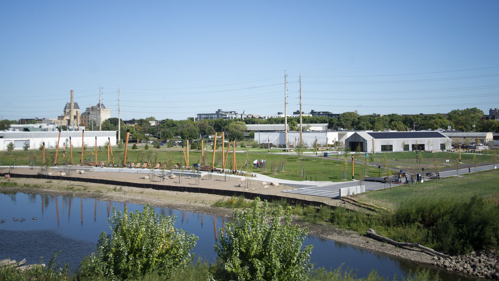 A photo showing the new park with a boardwalk along the river 