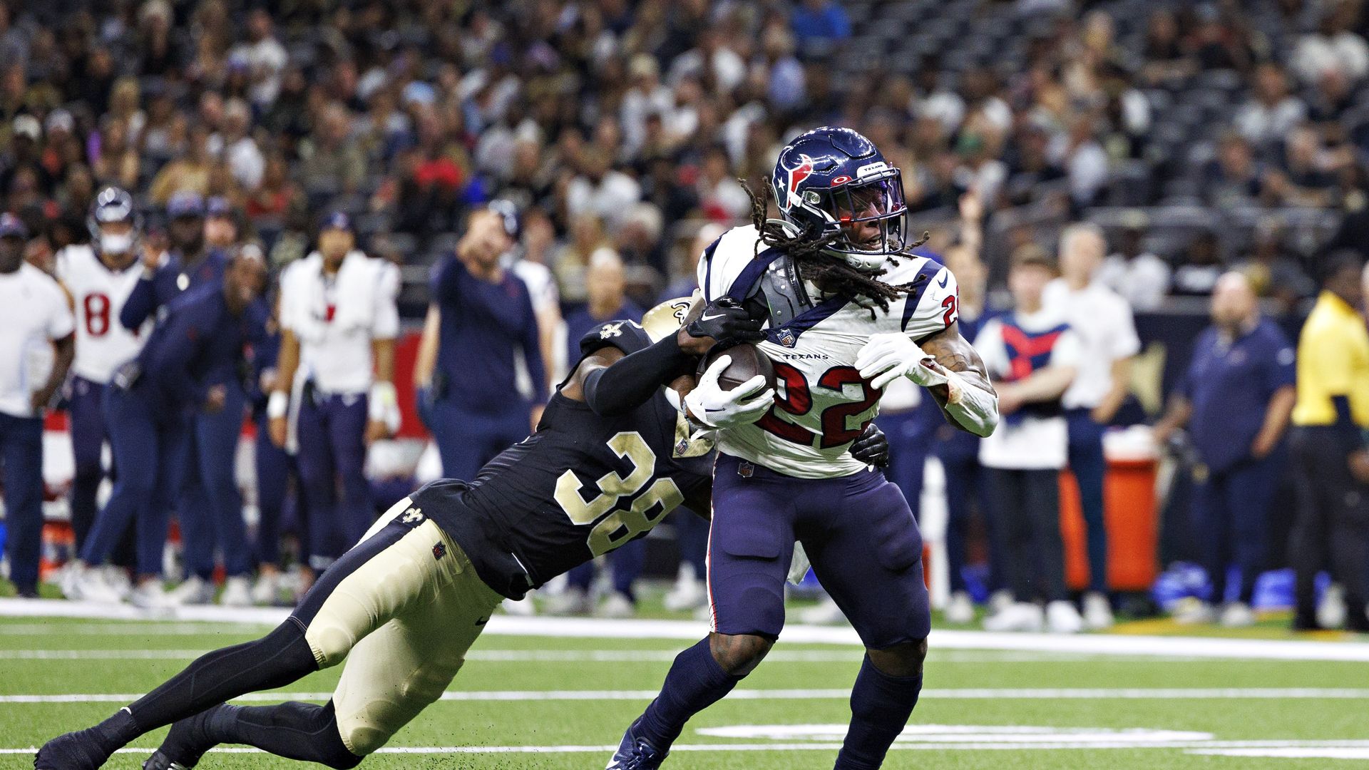 A New Orleans Saints player and a Houston Texans player during a preseason game on Sunday, Aug. 27.