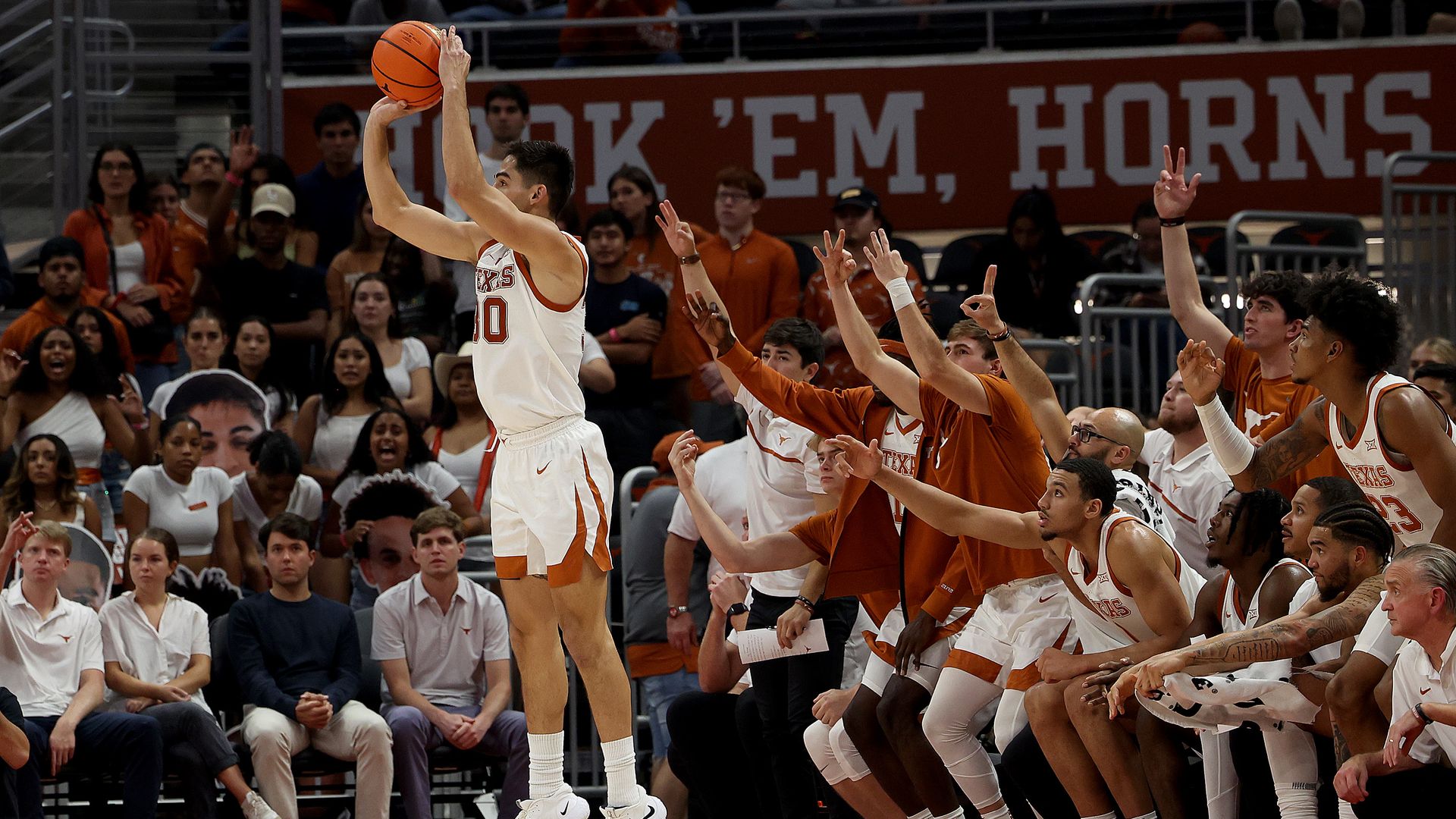 Brock Cunningham of the University of Texas shoots a three-pointer.