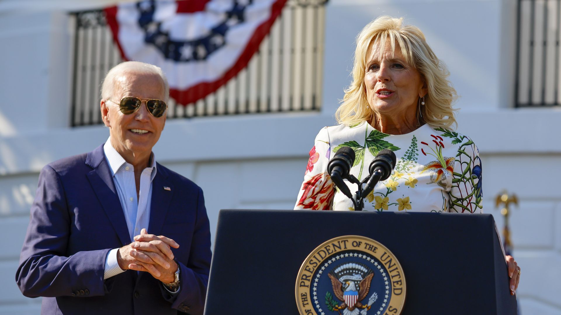 Jill Biden speaks while Joe looks on 