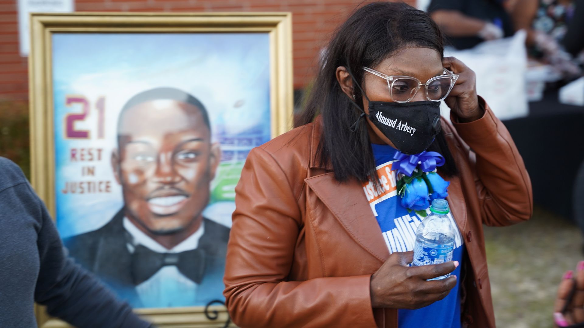 Wanda Cooper-Jones, mother of Ahmaud Arbery, stands in front of a painting of her son