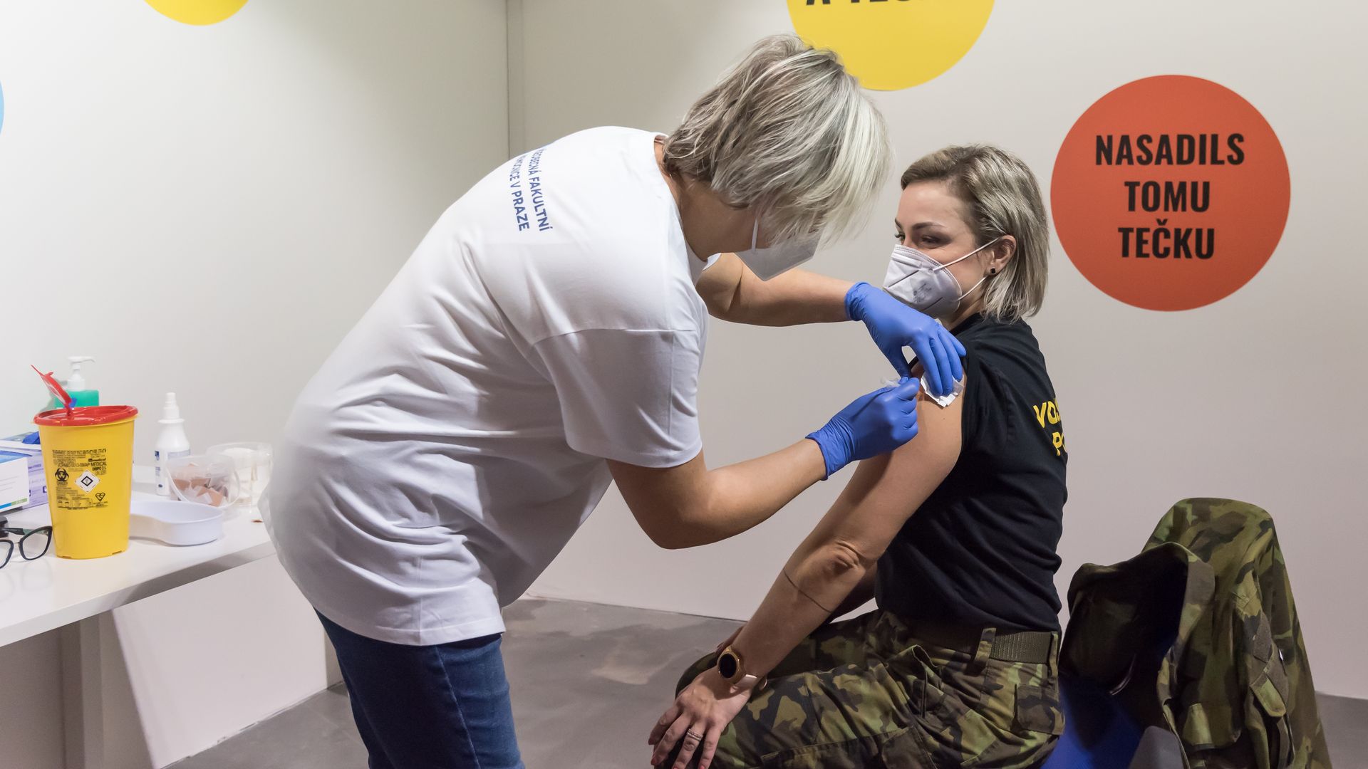 A person receiving a coronavirus vaccine in Prague in December 2021.