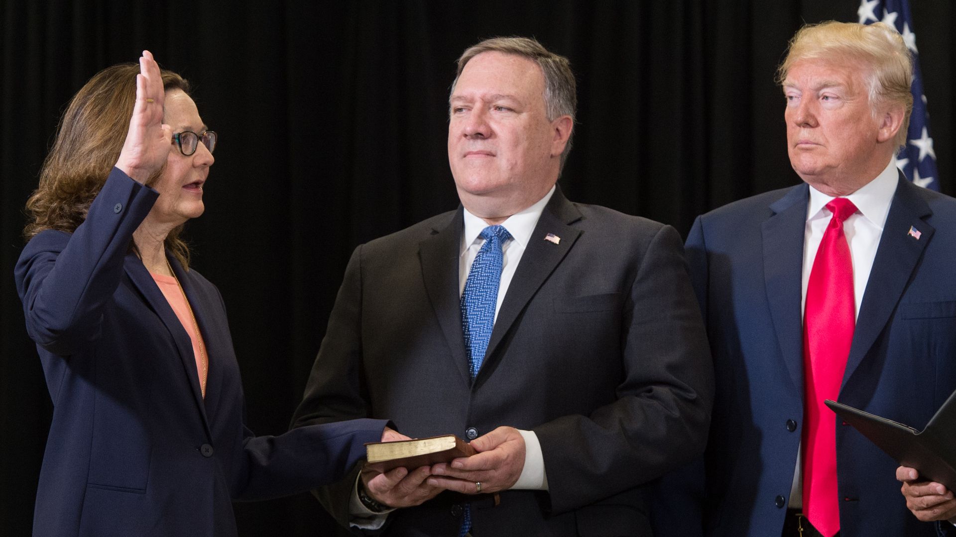Gina Haspel is sworn in as the Director of the Central Intelligence Agency alongside President Trump and Secretary of State Mike Pompeo in Langley, Virginia, on May 21, 2018. 