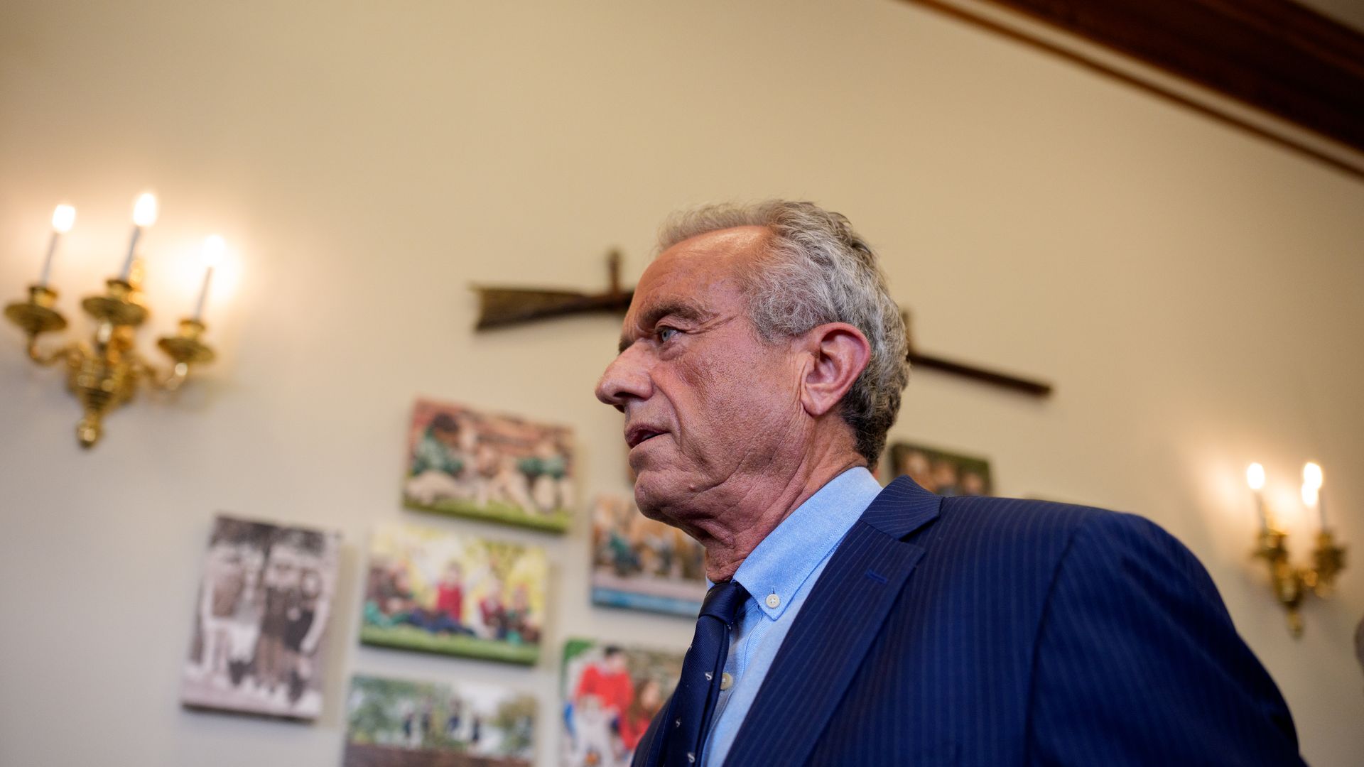 Robert F. Kennedy Jr. walks along a hallway.