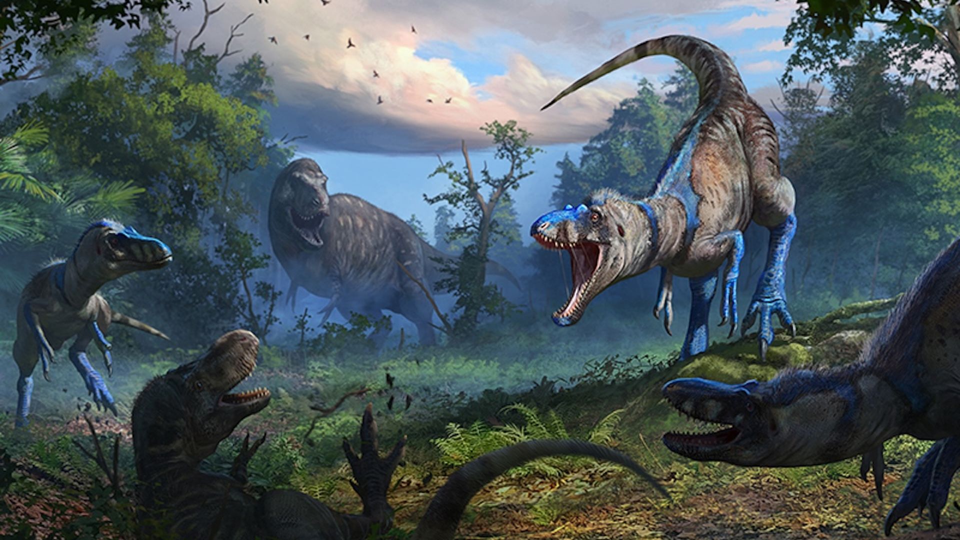 A group of blue and brown theropod dinosaurs interact in a lush forest with greenery and a partly cloudy sky during daytime, with some dinosaurs appearing aggressive or vocal.