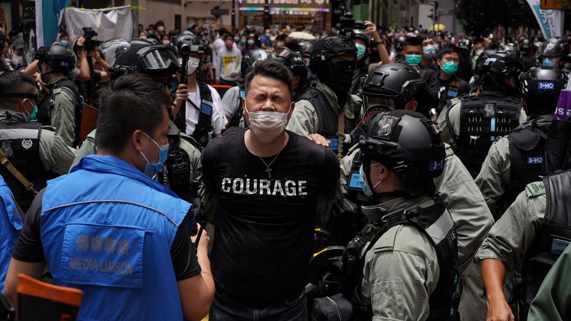 Photo of a pro-democracy lawmaker being arrested at a protest in Hong Kong