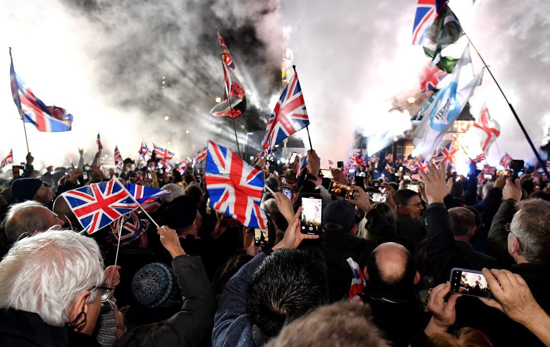Protesters waving United Kingdom flags