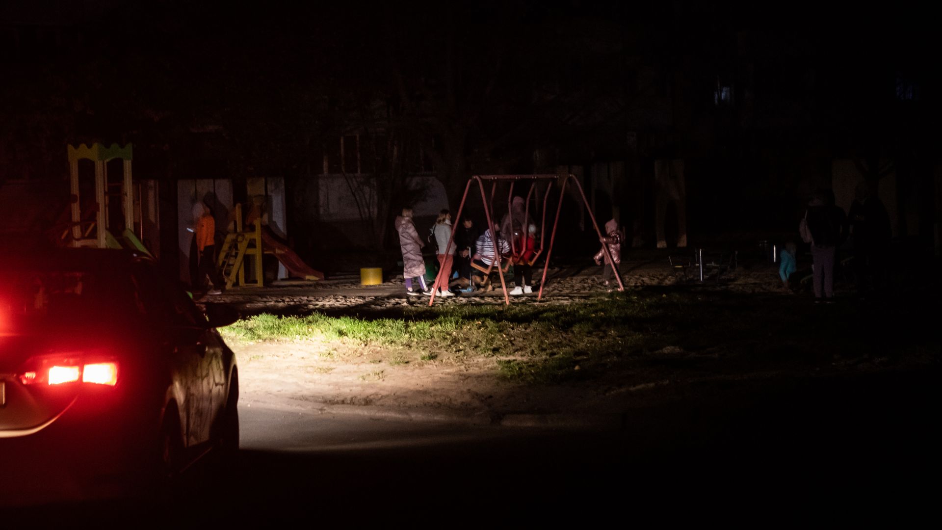 Families ar a playground during an emergency blackout in the residential district of Troieshchyna on November 1, 2022 in Kyiv, Ukraine.