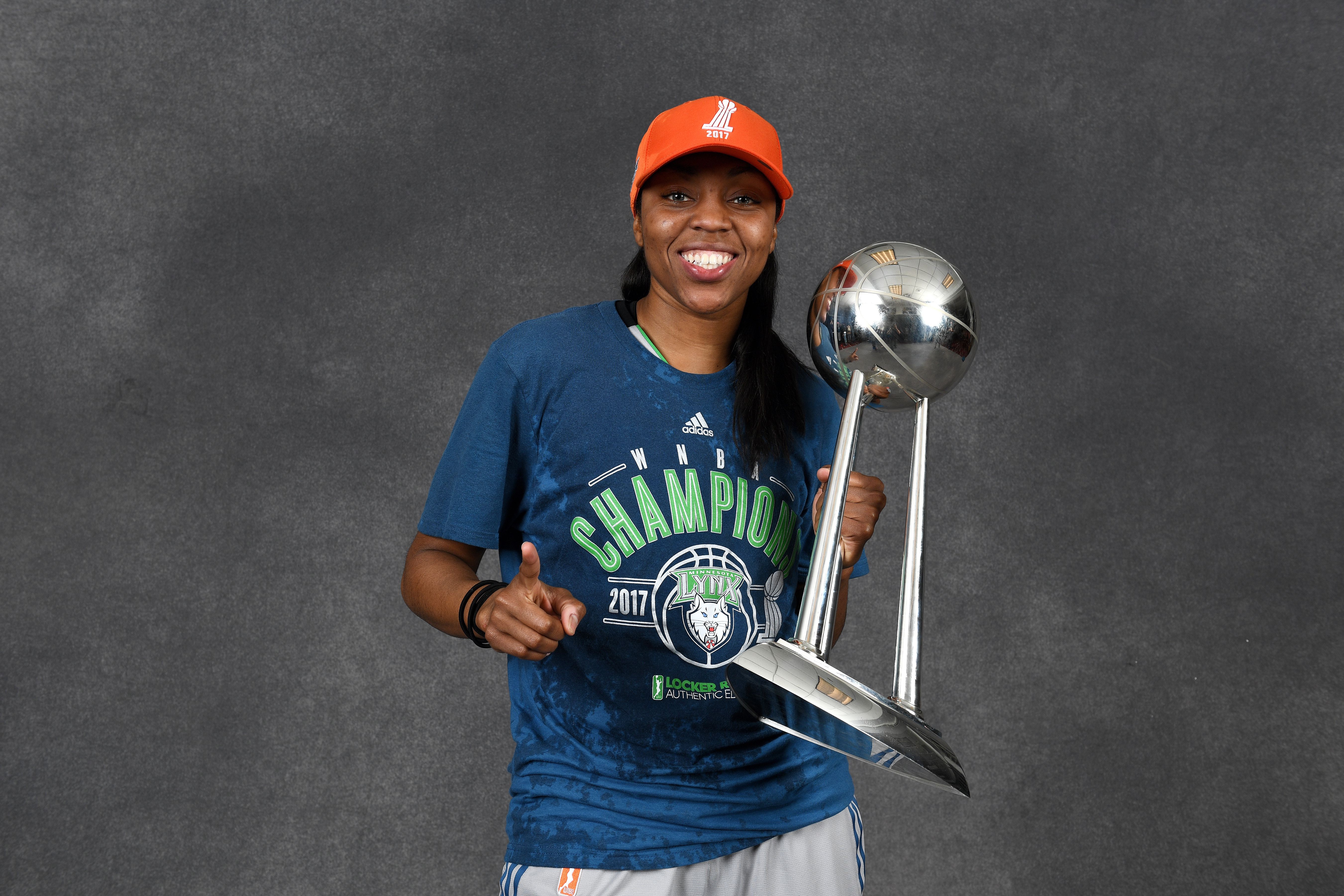 Renee Montgomery posing for a portrait while holding the 2017 WNBA Championship trophy after the game against the Los Angeles Sparks in Game Five of the 2017 WNBA Finals on October 4, 2017 in Minneapolis, Minnesota. 
