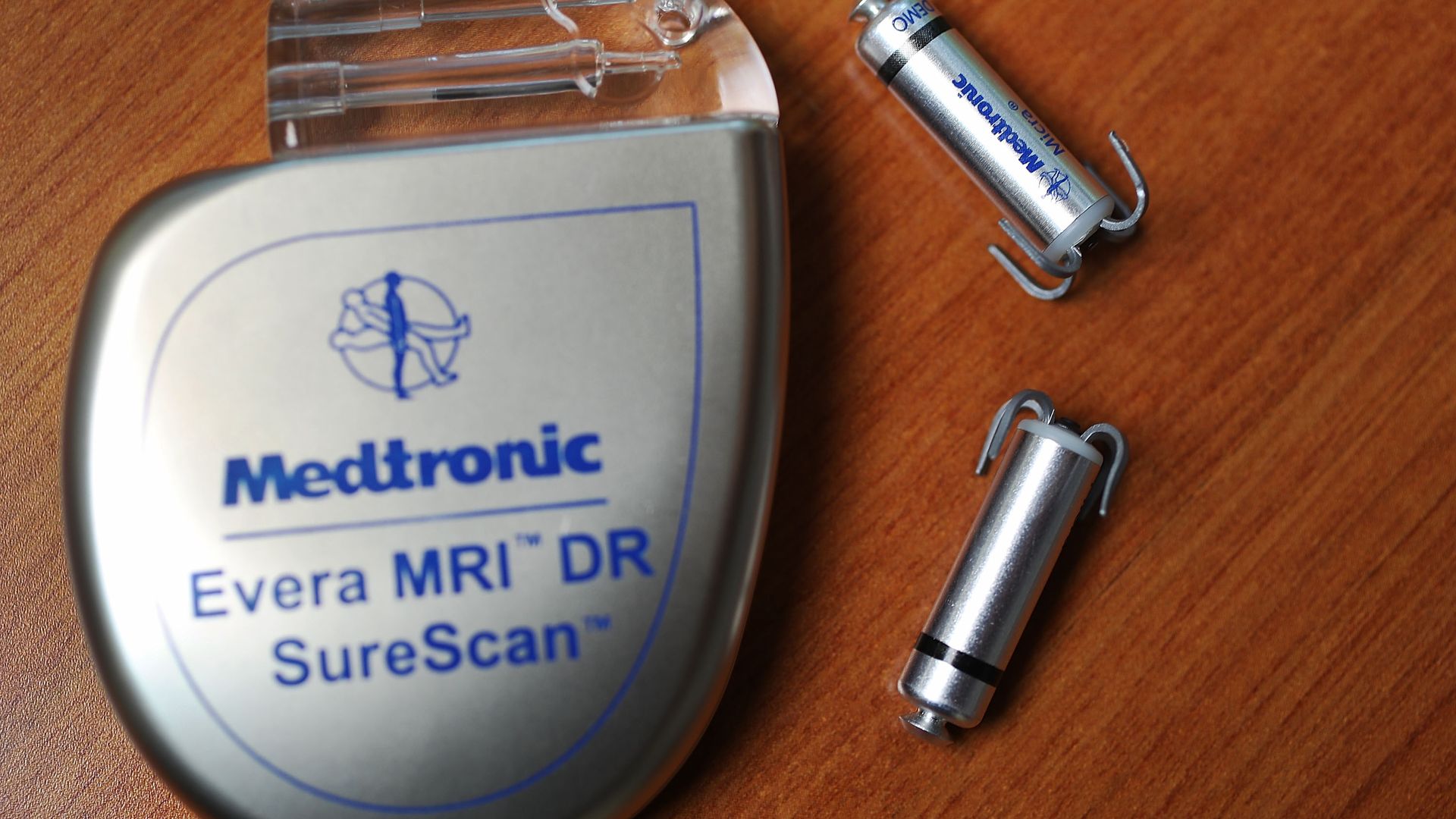 Two of the world's smallest pacemakers next to a normal sized one.