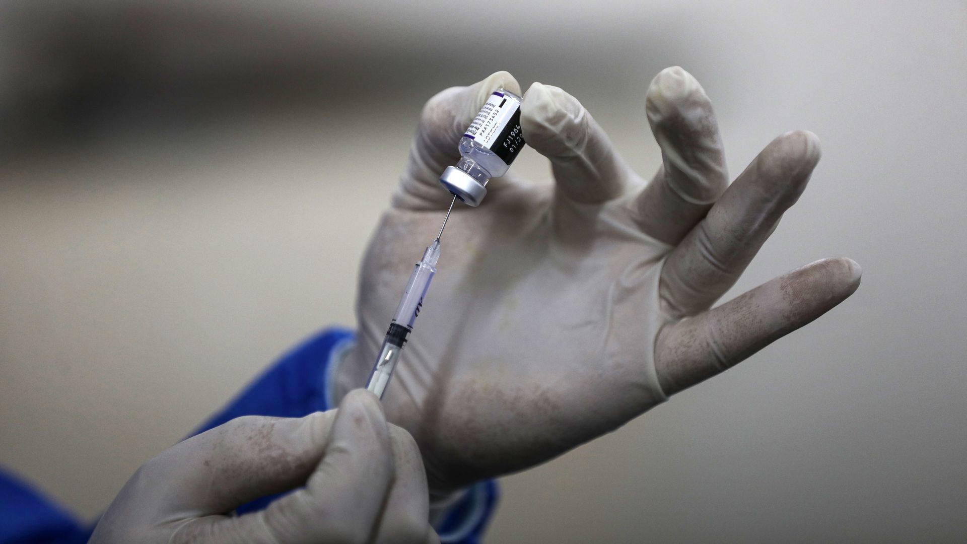 A health worker in Palestine preparing a dose of the Pfizer-BioNTech's coronavirus vaccine on Jan. 24.