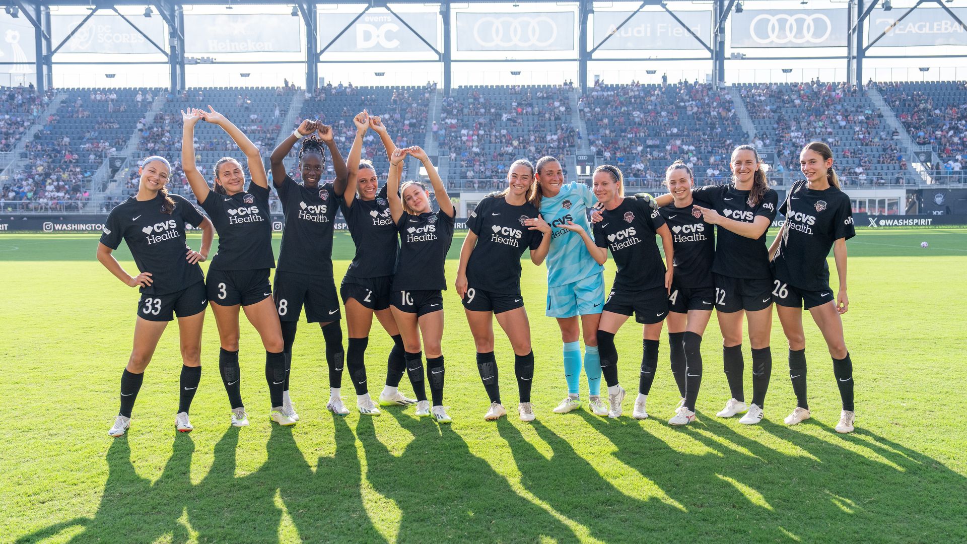  The Washington Spirit pose in black CVS-branded uniforms at Audi Field