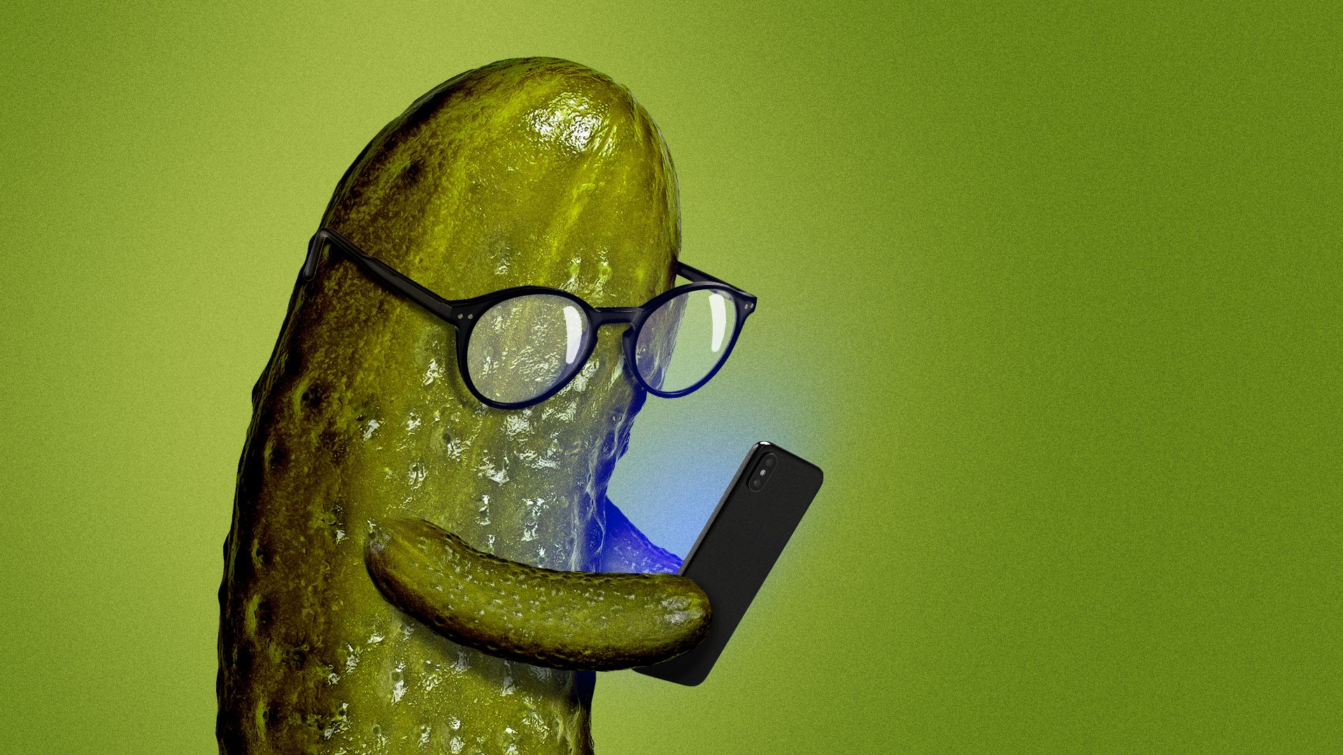 Illustration of a dill pickle wearing glasses and looking at its phone. 