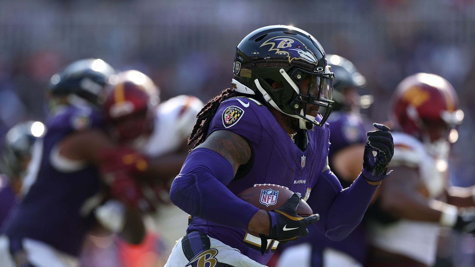 Derrick Henry #22 of the Baltimore Ravens rushes against the Washington Commanders during the fourth quarter at M&T Bank Stadium on October 13, 2024 in Baltimore, Maryland.