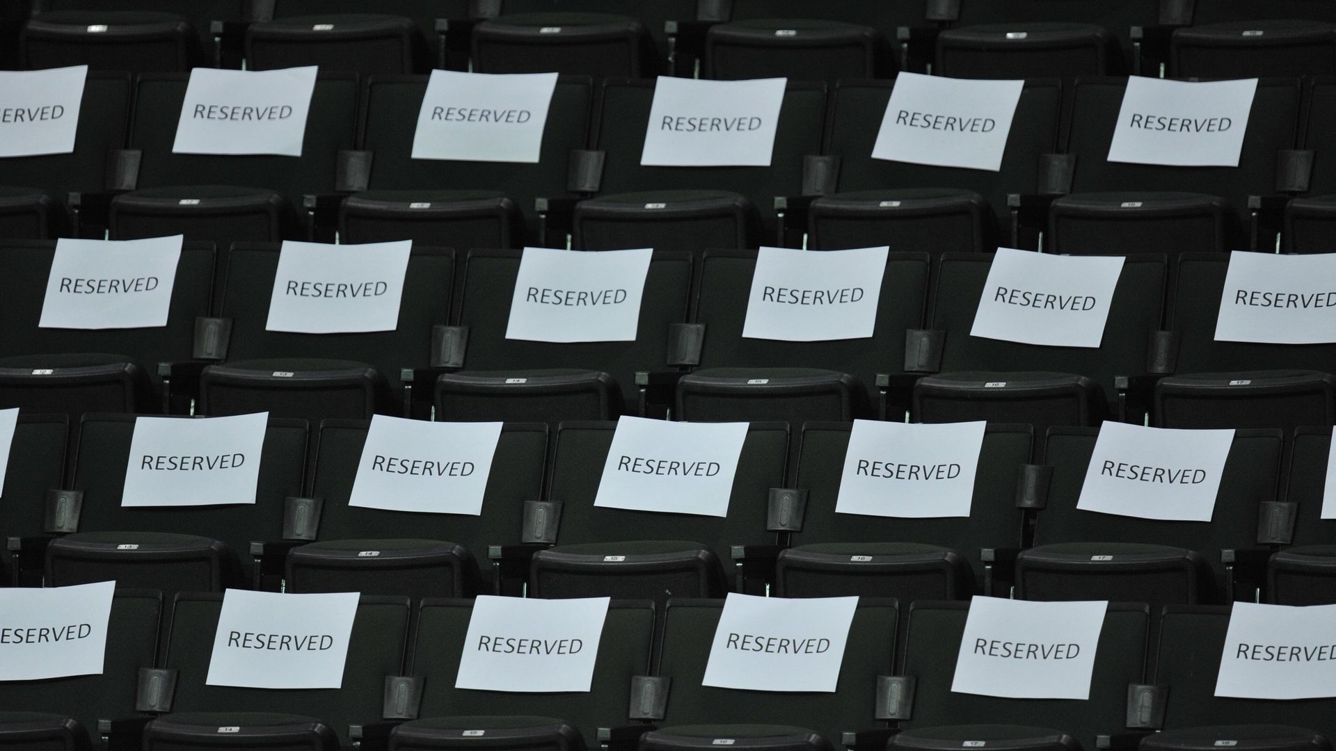 Seats with "reserved" signs on the seat backs.