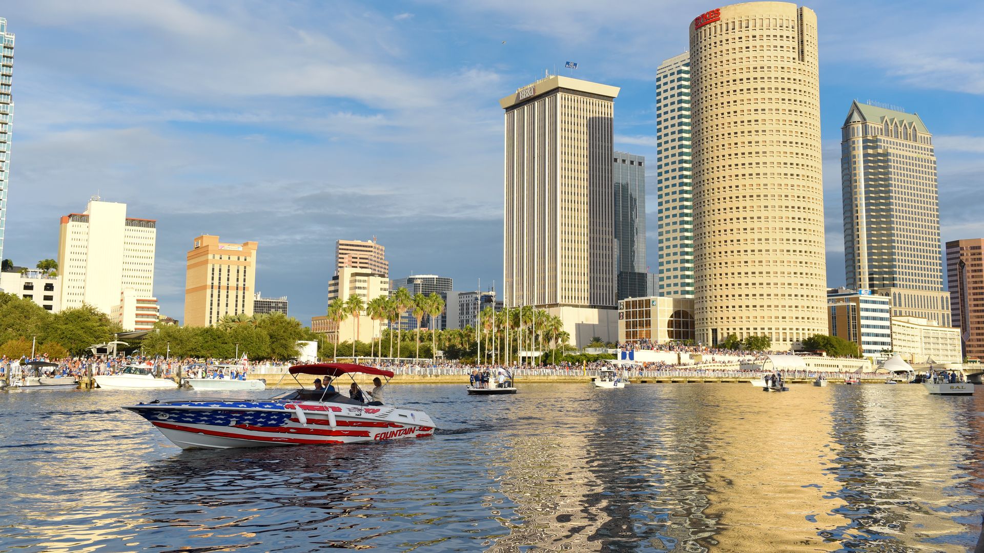 An American flag-themed boat cruises down the Hillsborough River. 