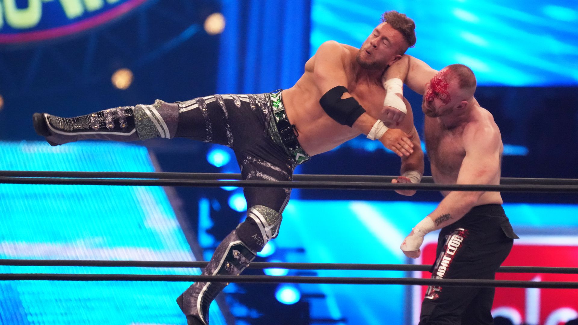 Two wrestlers fighting. 