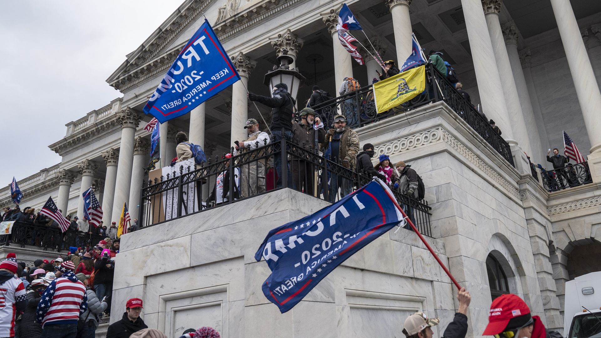 Supporters of then-President Trump are seen in the steps of the U.S. Capitol on Jan. 6.