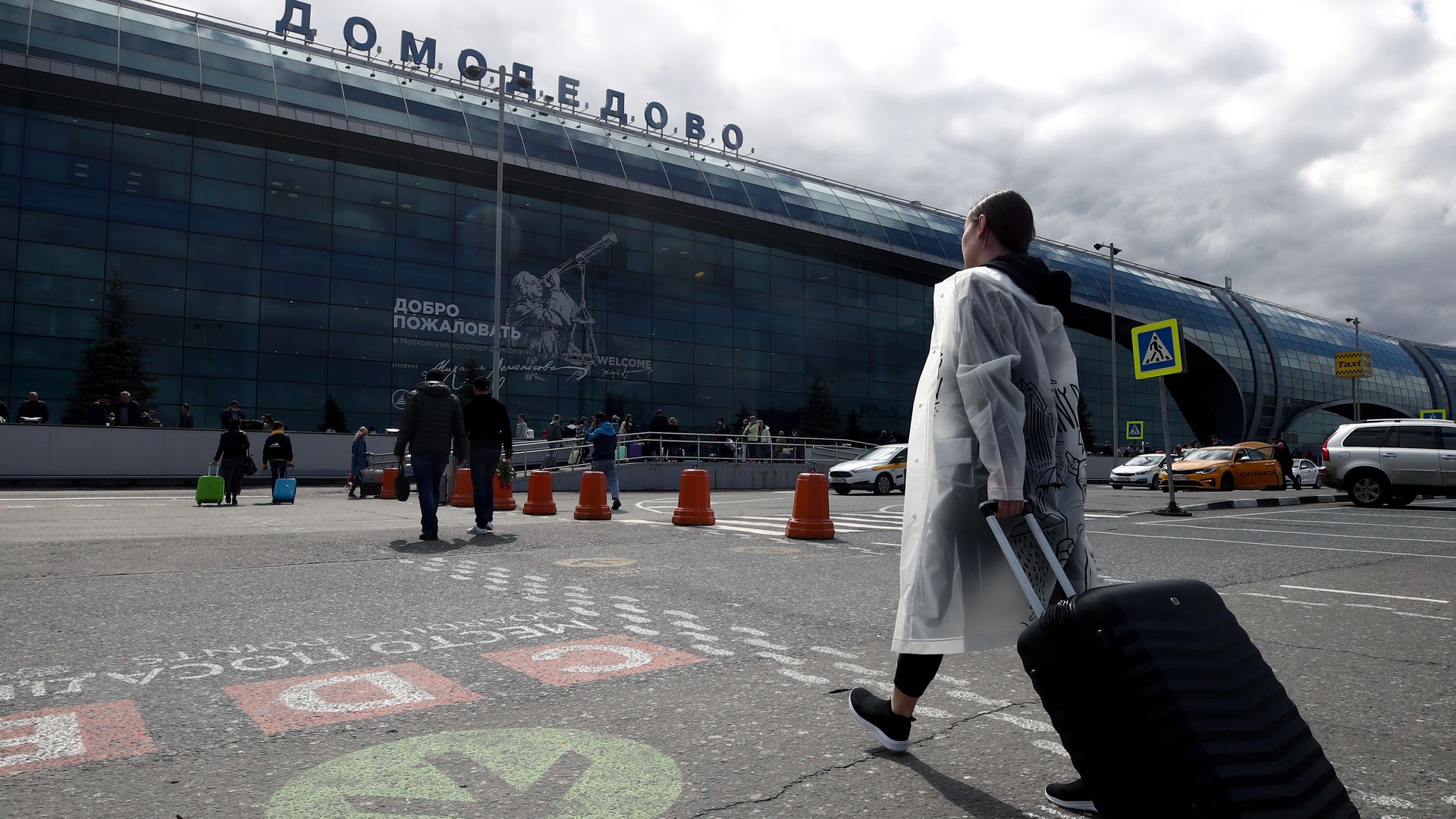 Travelers outside of the Domodedovo Airport outside of Moscow in April 2021.