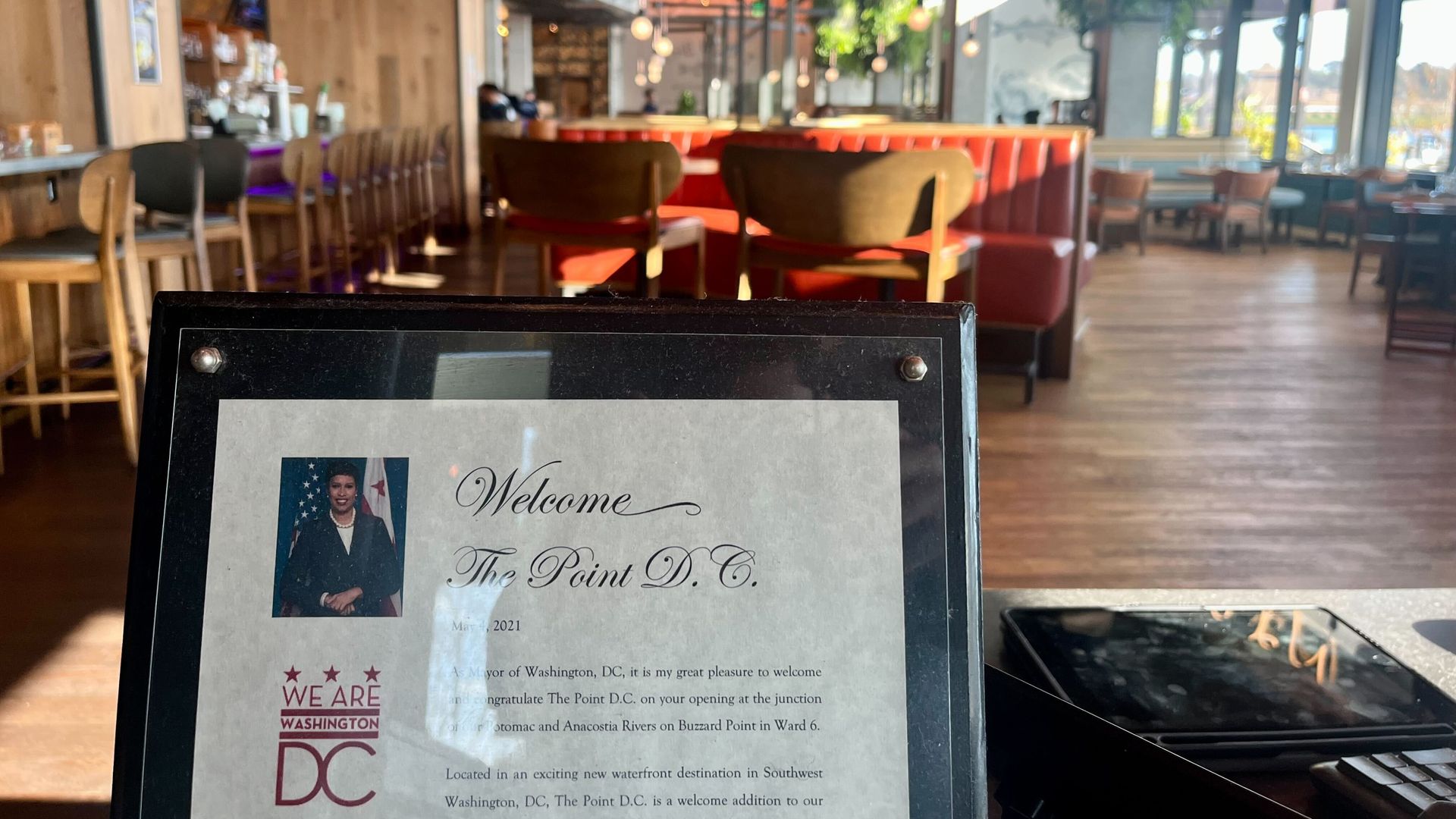 A framed letter from Mayor Bowser congratulates The Point on its opening, at the entrance of the restaurant