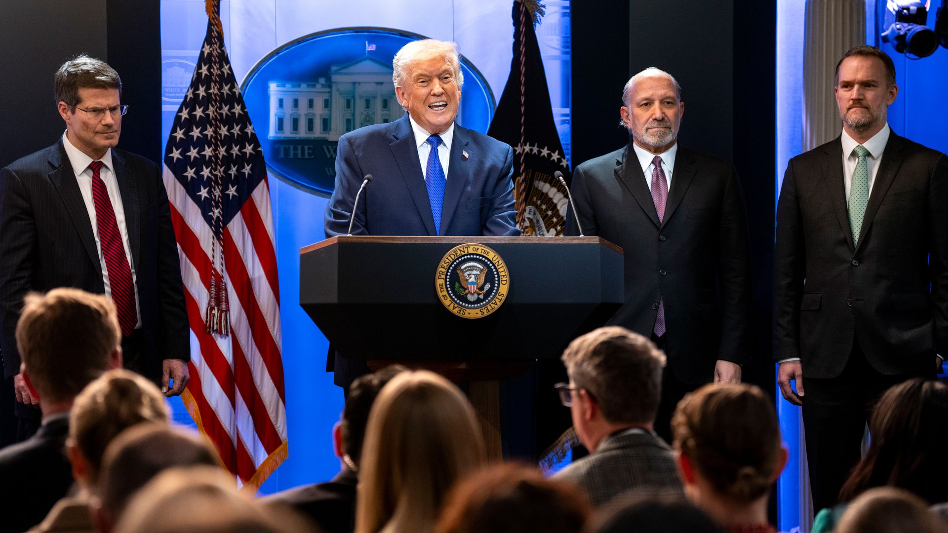 Trump speaks at a lectern 