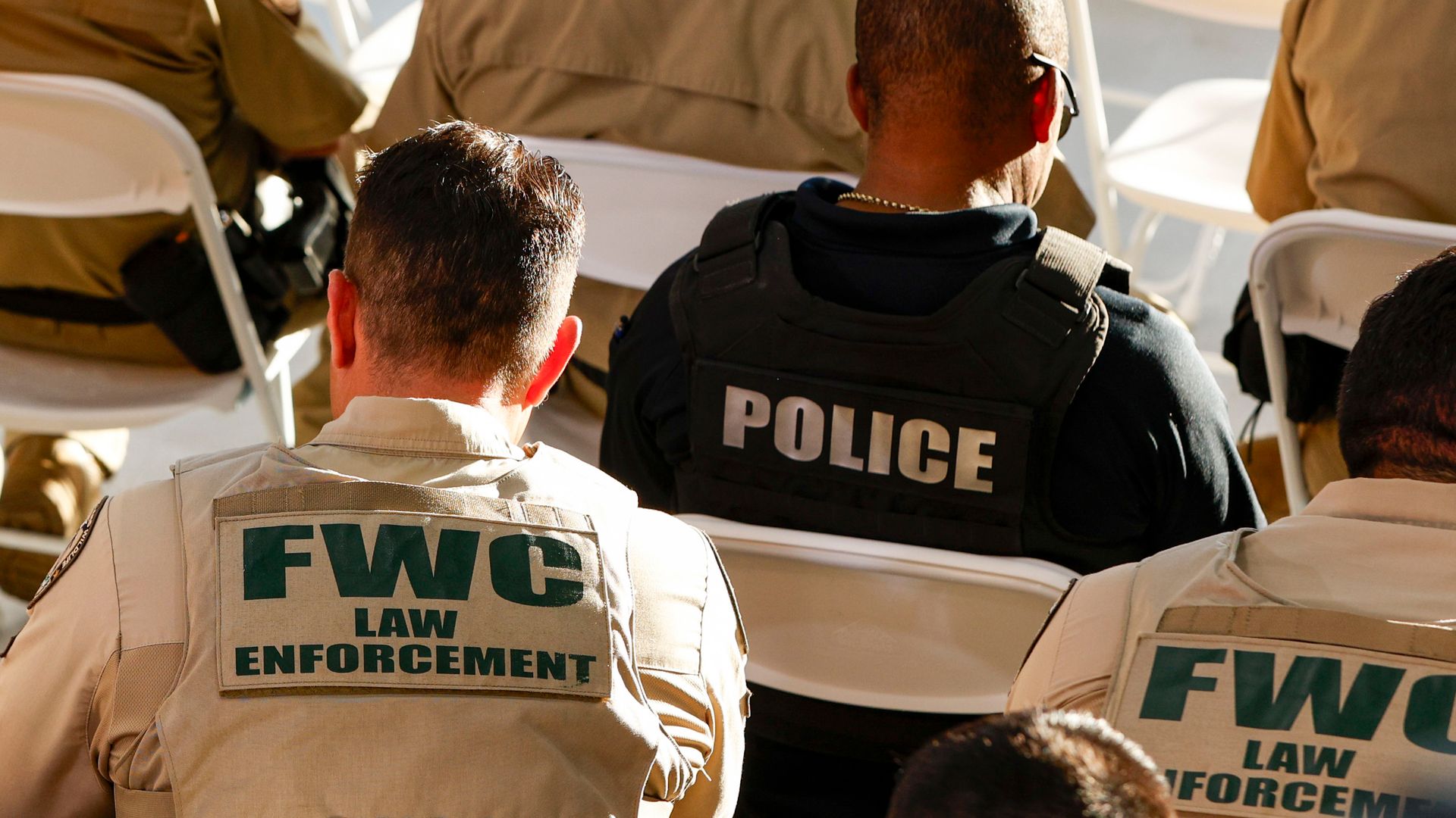 Florida Fish and Wildlife Conservation Commission (FWC) officers and a police officer during a news conference at Homestead Air Force Base in Homestead, Florida, US, on Wednesday, Feb. 26, 2025. The Trump administration is planning to require undocumented immigrants to join a federal registry, threa