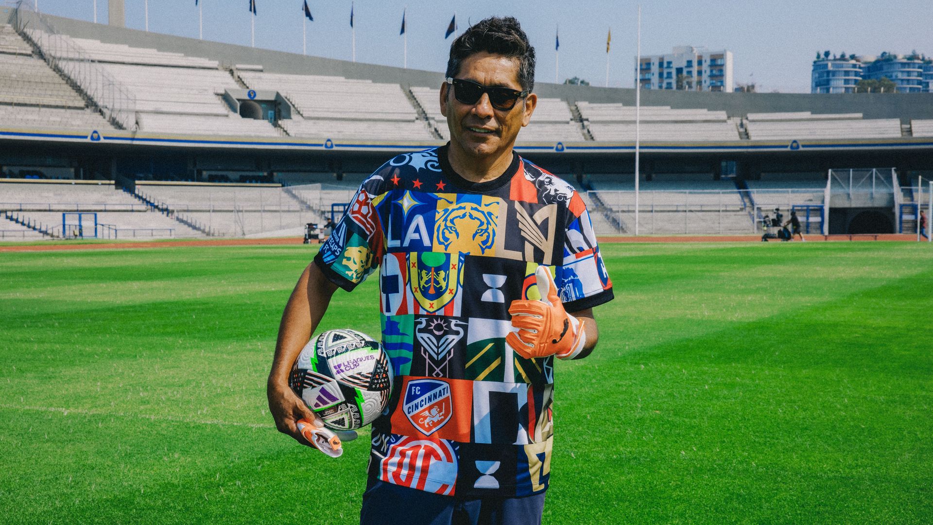 Man in multicolored t shirt on soccer field