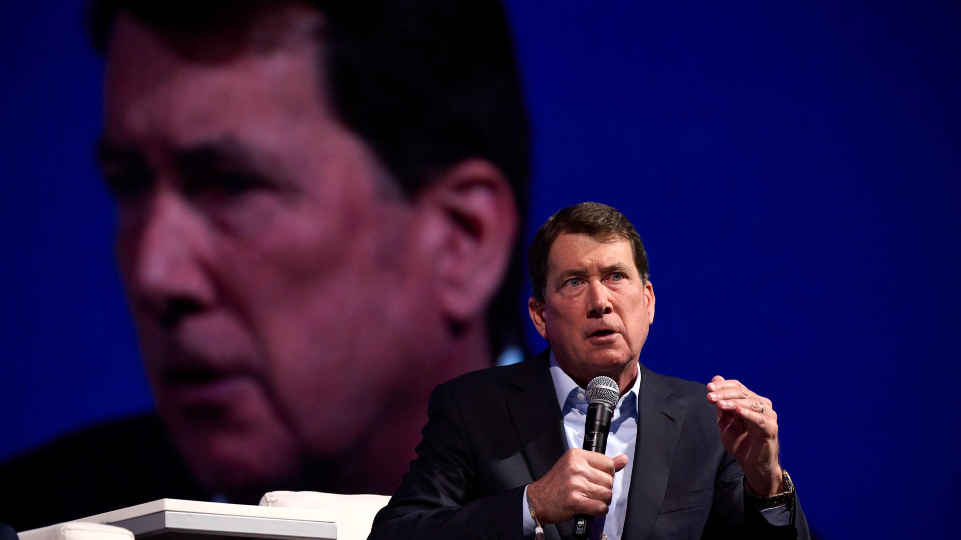 Man speaking on stage.