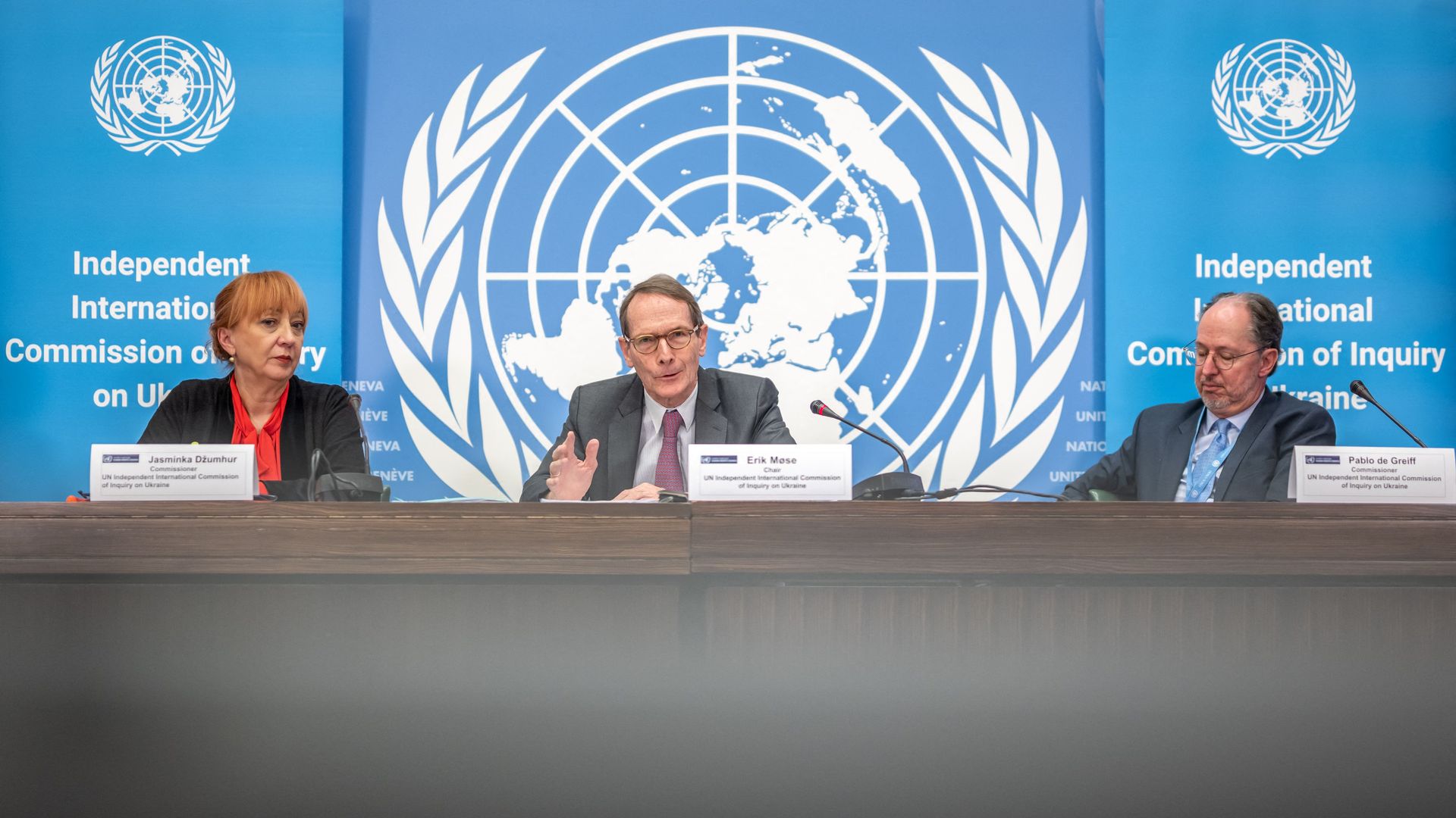 Chair of the Independent international commission of inquiry on Ukraine Erik Mose (C) and Commission's members Jasminka Dzumhur (L) and Pablo de Greiff (R) attend a news conference