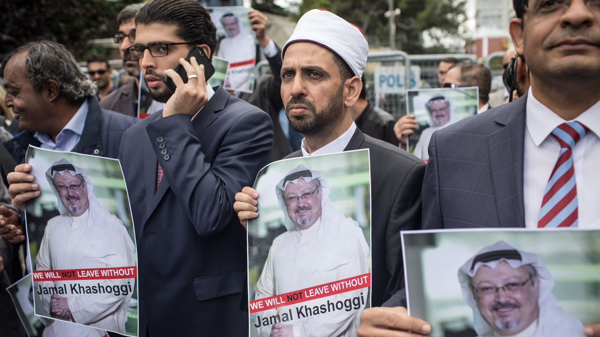 Protestors hold up signs for missing journalist Jamal Khashoggi
