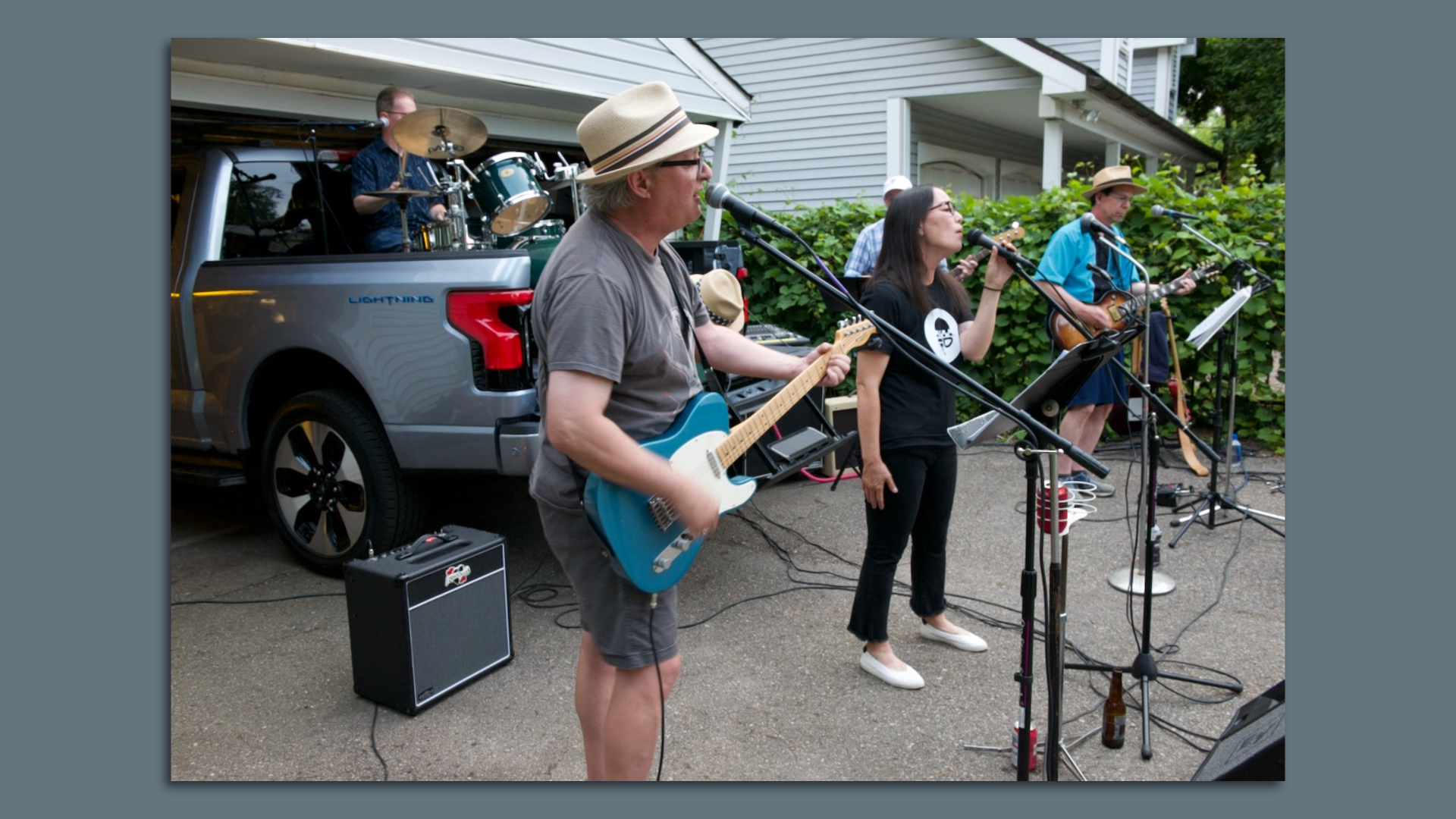 Members of the Exhaust Tones garage band, with amps and sound system powered by Ford's electric pickup truck