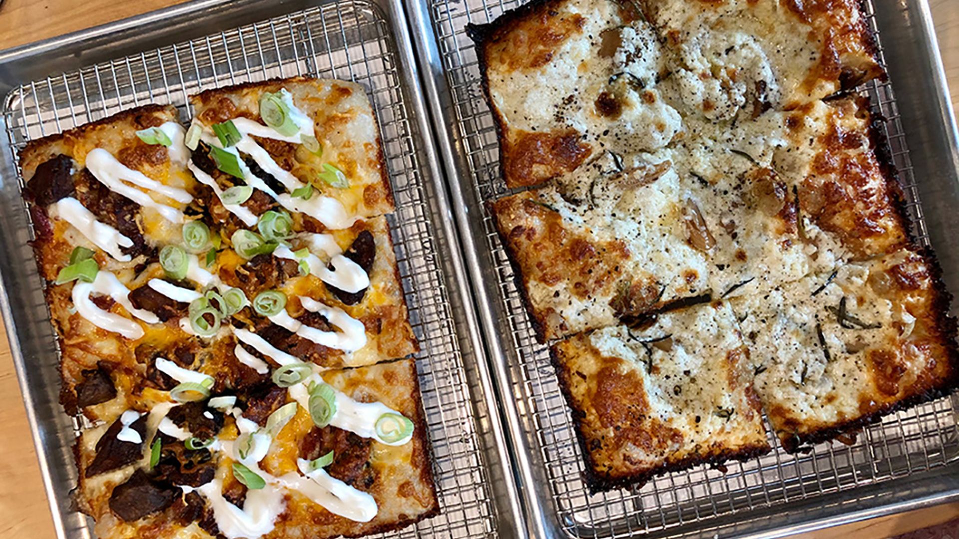 rectangular pizzas from eight and sand on trays