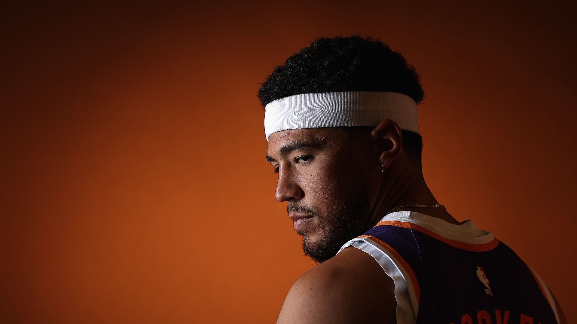 A basketball player posing for a photo. 