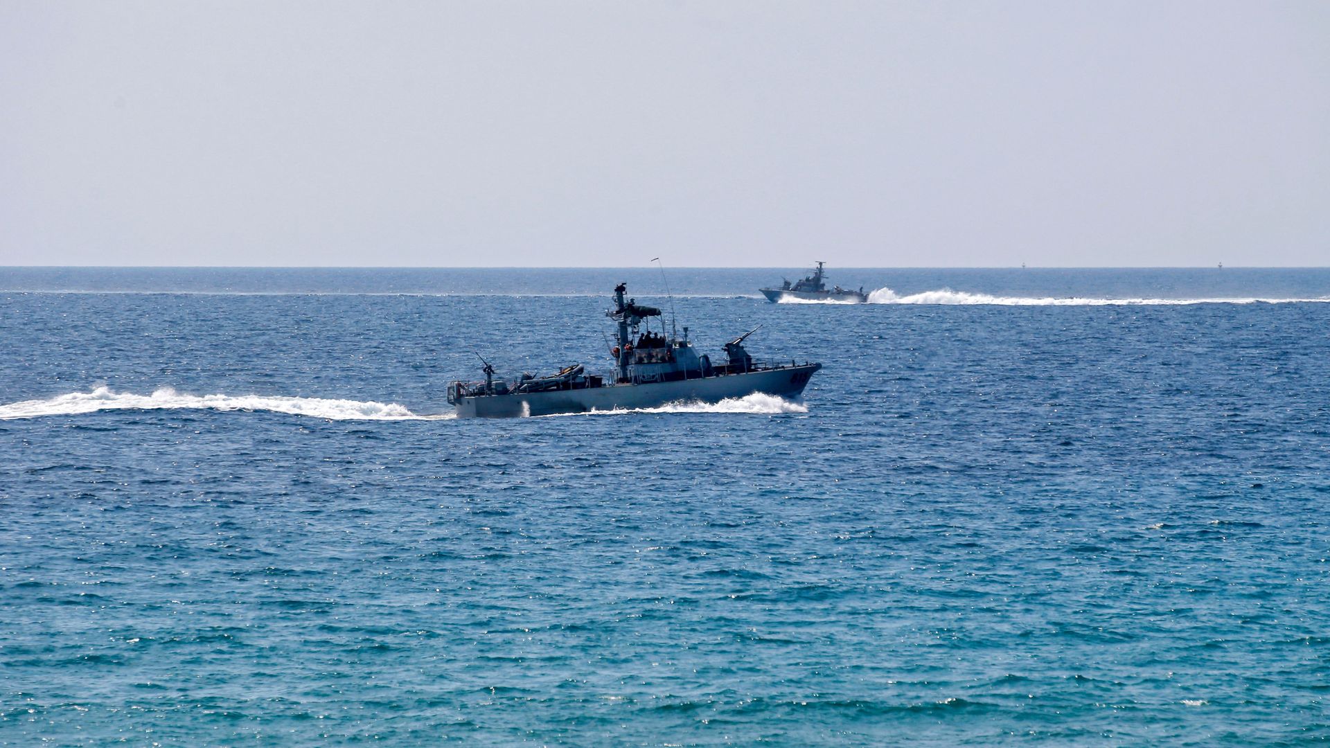 Israeli navy vessels patrol near the border between Israel and Lebanon. Photo: Jalaa Marey/AFP via Getty Images